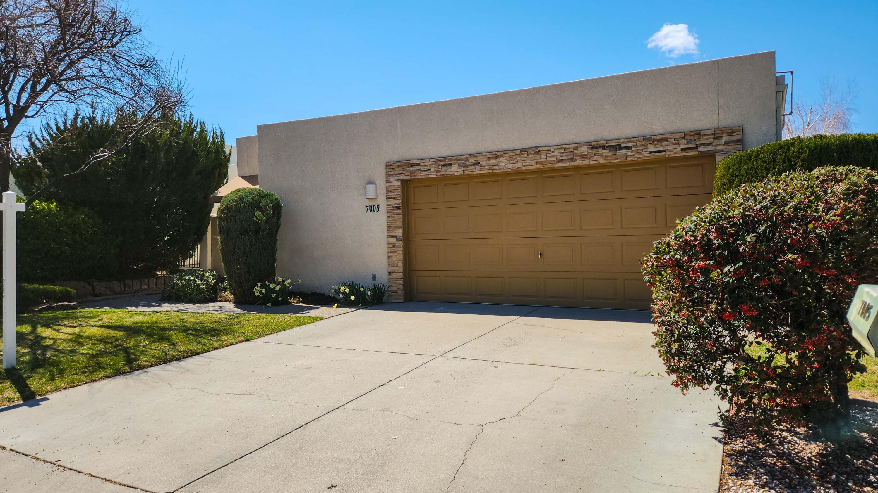 Wonderful chance to live in lovely Tanoan! This spacious high-ceilinged home includes a beautiful great room with fireplace, a generous primary suite with access to a low-maintenance yard, and two additional bedrooms to make room for everyone. An eat-in kitchen provides a cozy togetherness. This property was wonderfully maintained by Original Owners, and recent updates include backyard landscape, and newer appliances. Refrigerated air always a plus!