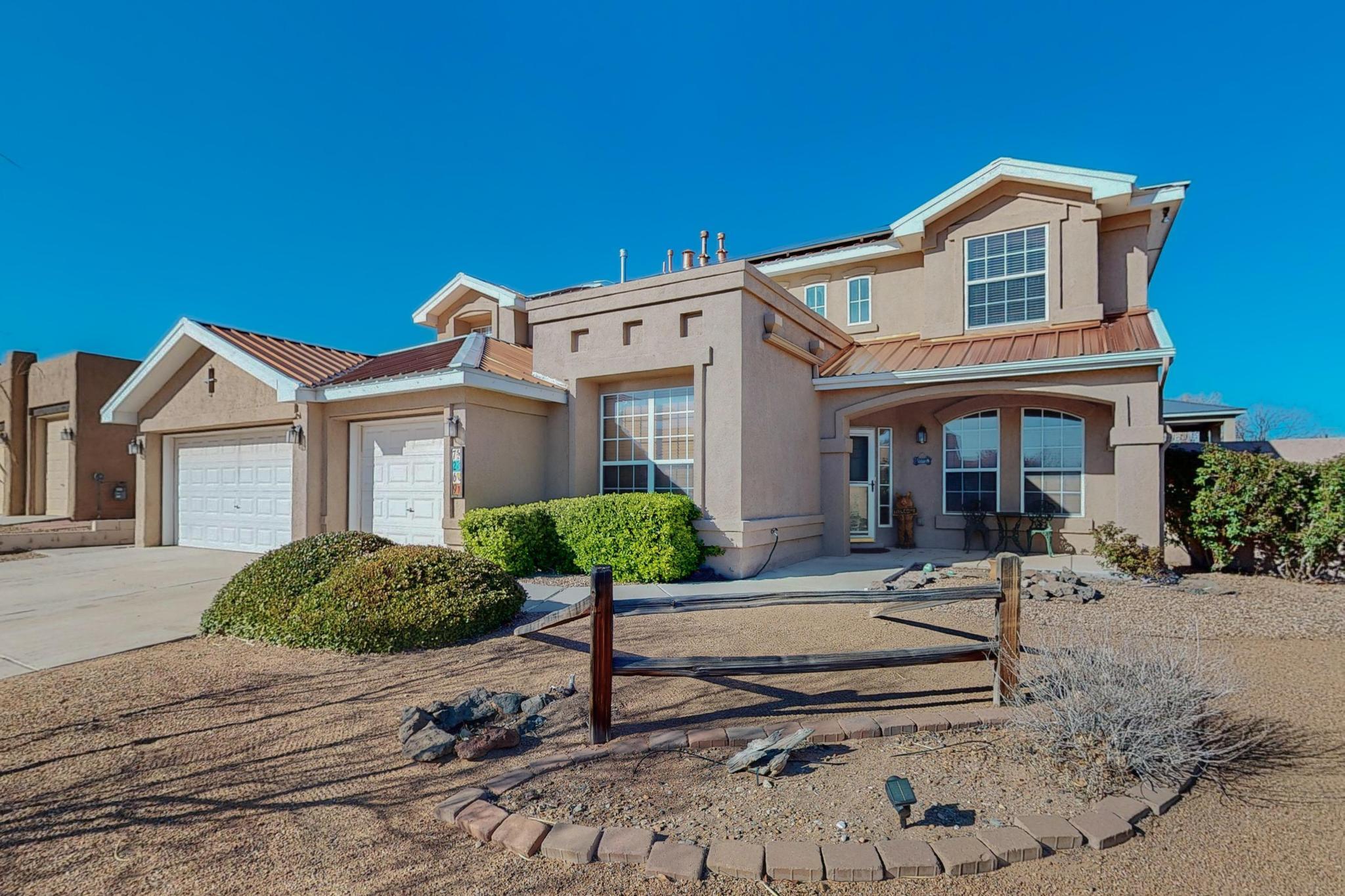 PREMIUM LOCATION! Stunning Rio Rancho home, perfectly situated on a large corner lot, offers unmatched convenience. Just 30 min from Santa Fe & 15 mins from Albuquerque, close to golf, casinos, dining, shopping, hospitals, I25 & more. With over 3000 sq ft, 4BR/3.5BA, 3-car garage, plus a versatile loft w closet, it's ideal for large family living. Upgrades incl. custom paint, copper color metal roof, $45k seller-owned solar system, water softener w/ R/O system. Fully landscaped front/backyards boast outdoor seating/grilling & raised planter beds. Main floor incl. primary BR with ensuite, 2 walk-in closets, laundry w/sink, office, dining, breakfast nook, built-in desk. Upstairs: jack-and-jill BR's, cozy bench seat BR, huge loft. The perfect blend of luxury and functionality. Move in ready!