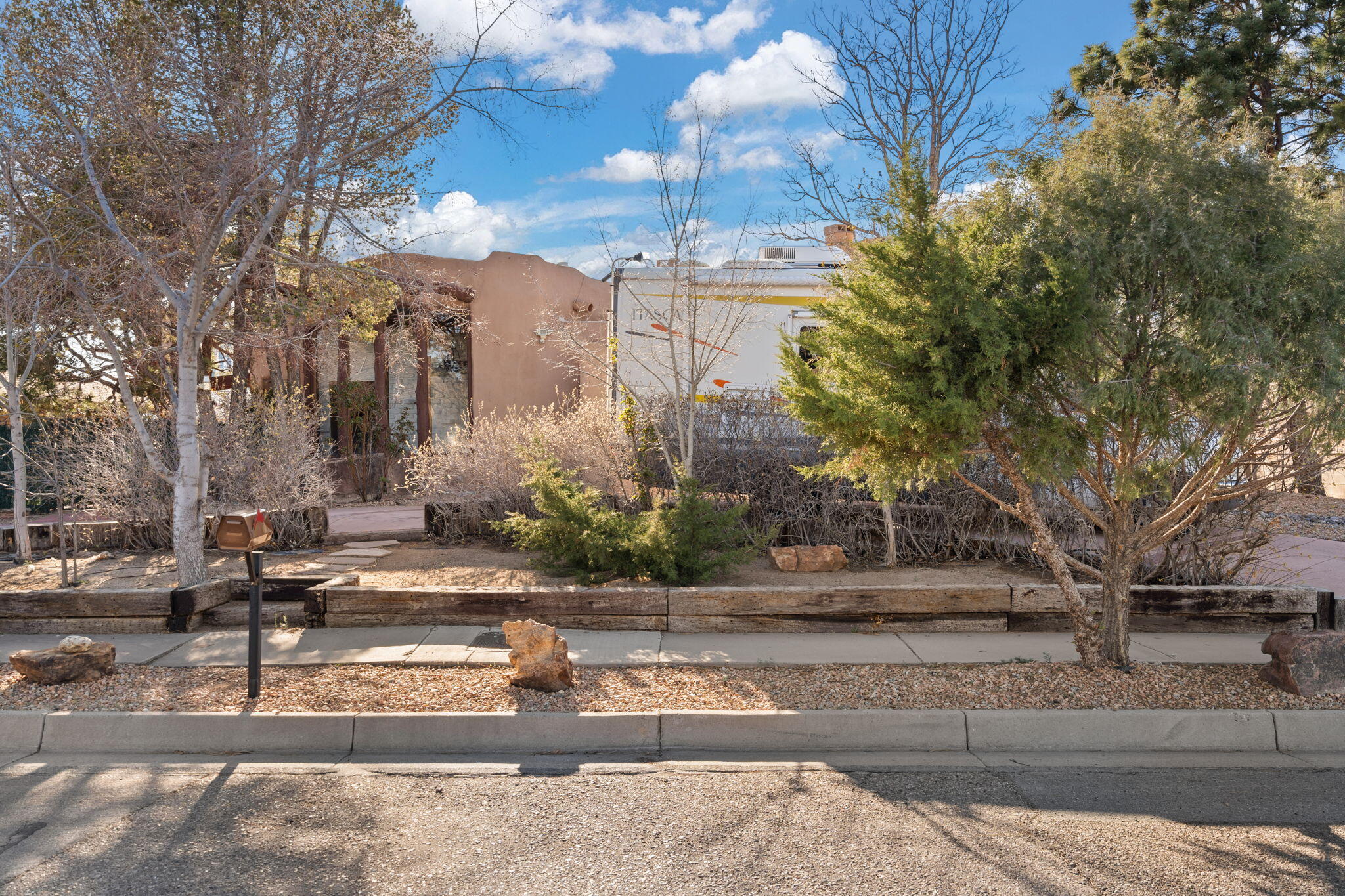 Location, character, style, uniqueness. This incredible 5bd/3ba home has all of that and more. Designed by Architect Ivor Williams as his personal residence, this custom built, circular adobe home does not disappoint! For those who seek out the original and shun the mundane; this is the home you need to come see. No lackluster, cookie cutter, same ol' thing here. Vigas, kiva fireplaces, a spiral, jetted, primary suite shower/bath and a sunroom await you inside, and outside, enjoy beautifully landscaped areas perfect for entertaining, with backyard street access from San Pedro to the spacious multi-car garage. This home literally has it all! Even has a full sized traditional Horno (bread oven) with a rotisserie, right off the kitchen! You need to see it to believe it, so schedule today!