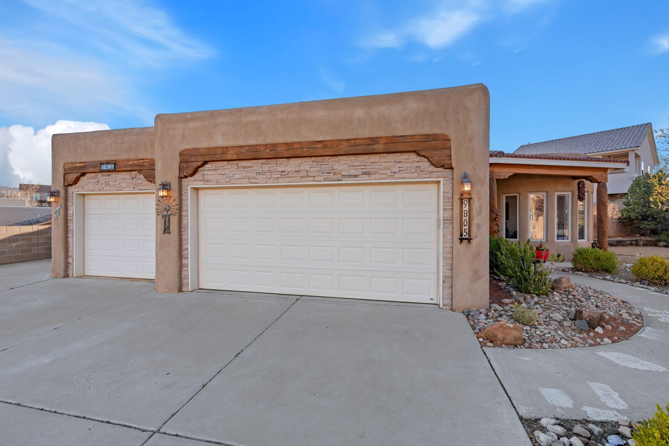 Welcome to this charming 3 bedroom, 2 bathroom home, thoughtfully created layout,  tons of natural light floods the home through large windows, and architectural details of the home include a gas kiva fireplace, nichos, vigas, and arches, adding character.  The kitchen features granite countertops, stainless steel appliances, and 42'' upper cabinets and spacious pantry. This home boasts spacious front and back yards with a drip irrigation system, fountain and arbors.  Additional amenities include a spacious storage shed and a 3rd car garage partitioned off to serve as an office, workshop, or exercise room. Solar panels are owned. Don't miss the opportunity to make this exceptional property your own!