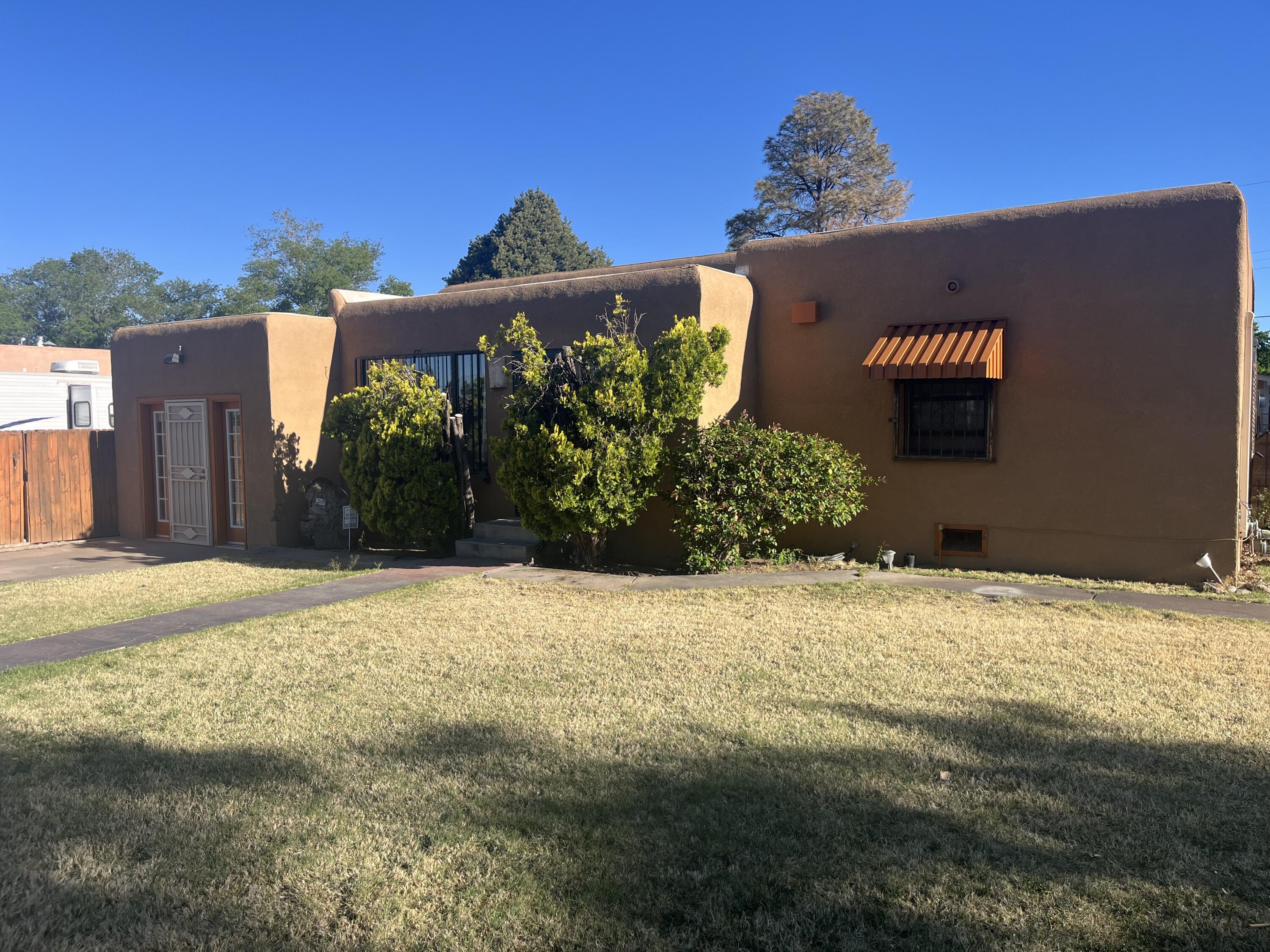 Well-maintained Vintage Home in the heart of the South Valley. Space galore & lots of room to spread out. Located on an oversized lot in this mature neighborhood, complete with mature landscaping & tree-lined extra-wide street.Home features 3 Nice-sized bedrooms and a centralized full bathroom. The large Living room flows into the efficient kitchen. The converted one-car garage gives an additional get-away space, as does the other living space on the other side of the kitchen. The flowing floorplan gives the feeling of an extra large house.Outside, Backyard access is available for that RV or Boat Storage.  The oversized lot has lots of room for evening chill time & gatherings; it also boasts of a newer oversized detached two-car garage.