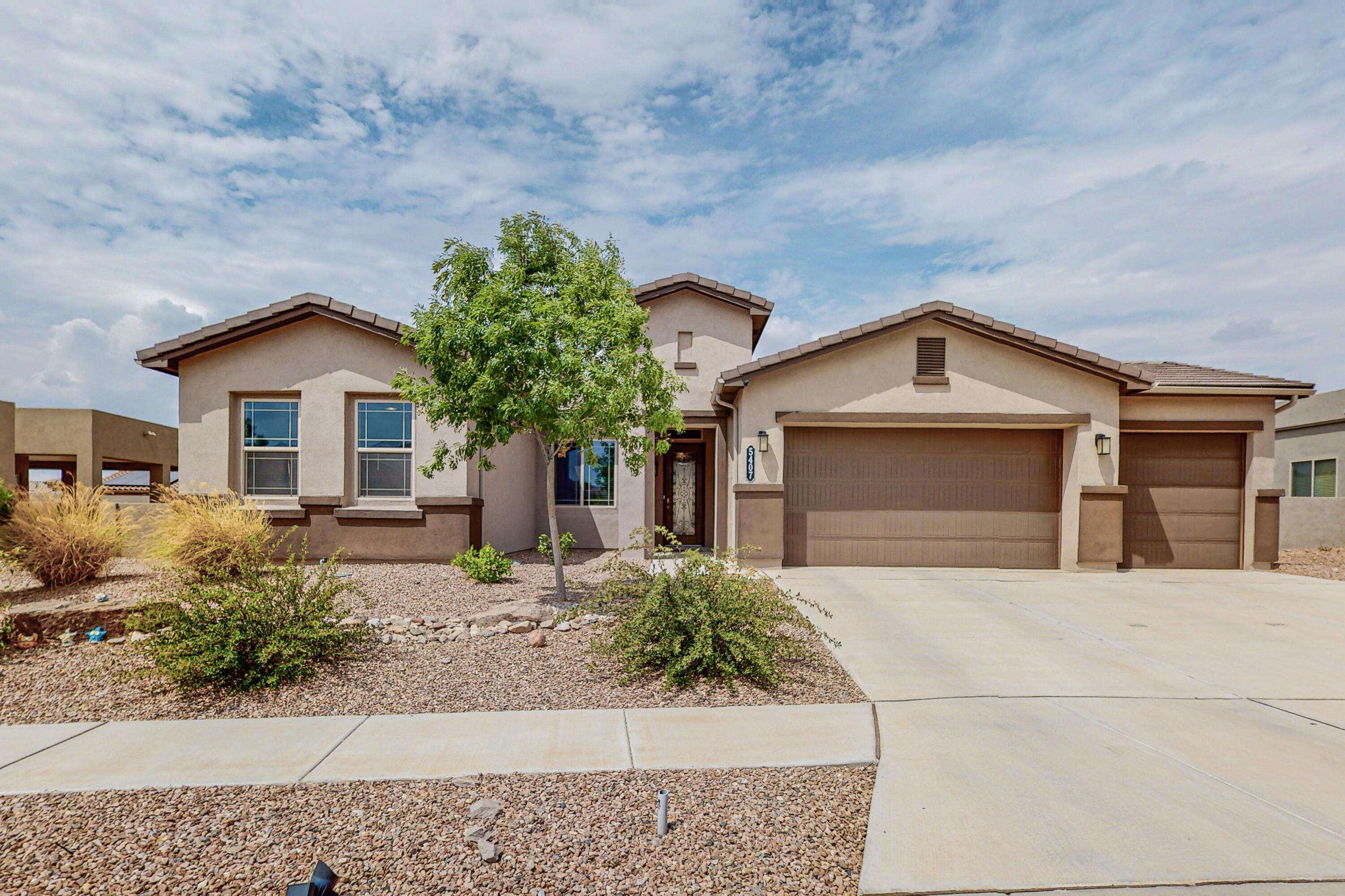 Welcome to your new home in the gated community of The Peaks, nestled in the picturesque Mariposa. This stunning residence boasts high ceilings that create an airy ambiance, filling every corner with abundant natural light. The thoughtfully designed floor plan maximizes functionality, offering a seamless flow throughout. Step inside and be greeted by a beautiful entryway adorned with elegant wainscoting, setting the tone for the elegance that awaits. With four spacious bedrooms and three and a half bathrooms, this home provides ample space for your family's comfort. Discover the convenience of a separate jr suite featuring a large walk-in closet, ensuring privacy perfect for a guest room.