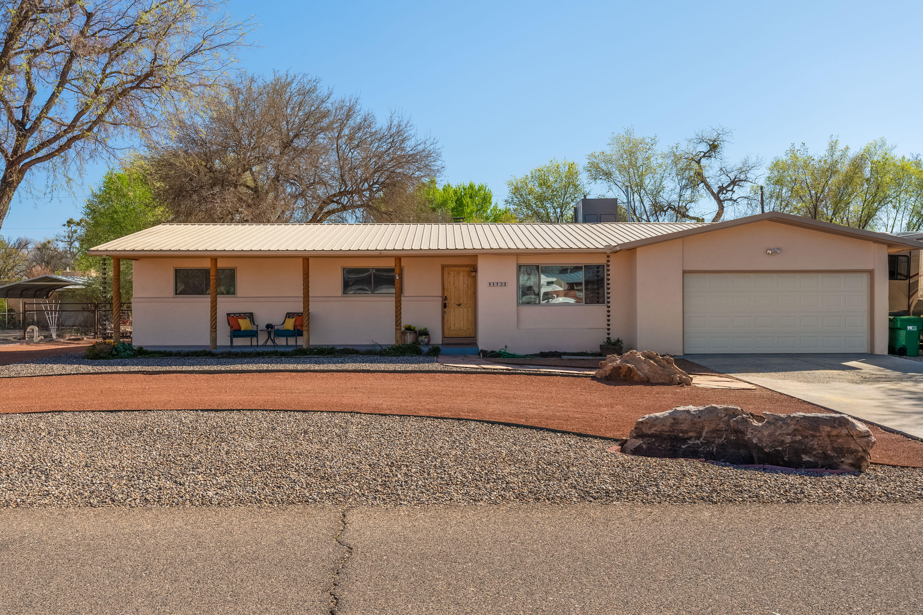 Welcome to the Country!  Bring your horses and bring your RV to this North Valley Beauty with over 2600 sq.ft. of living space.    Possible 3 living areas, separate dining, remodeled kitchen w/all appliances, 4/brs, 3/ba and 4 garages (2 attached, 2 detached)!!  Refrigerated Air, Pitched Metal Roof and more.  Outback you'll find a huge, covered patio suitable for entertaining PLUS a two-horse stable w/horse run.  This Single-story home sits on a 1/2 acre lot and has BYA w/RV electrical hookups on both sides!!