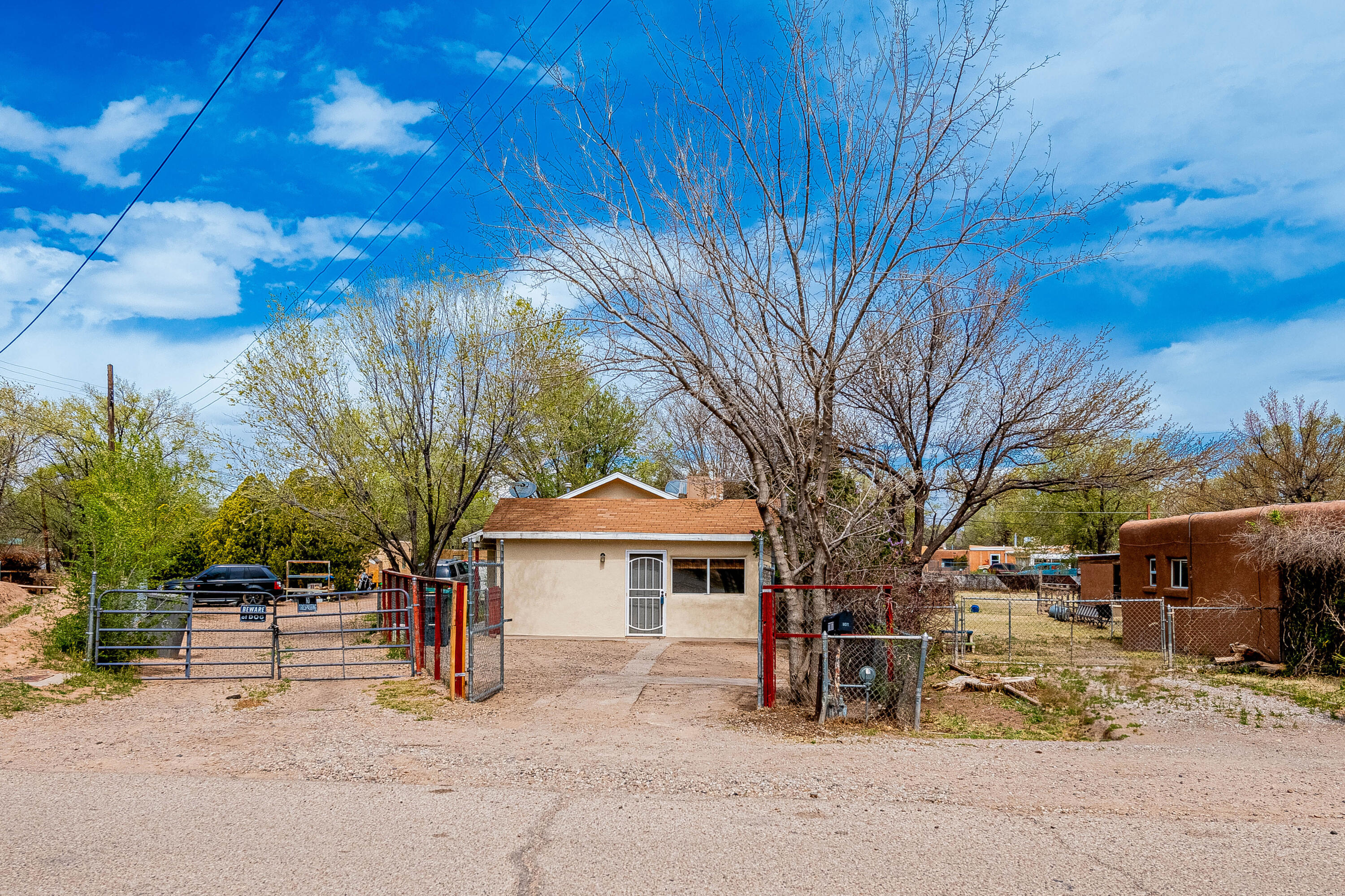 Welcome Home to this South Valley Gem! This spacious 3 bedroom, 2 bathroom home boasts a versatile flex room that can easily serve as an ensuite bedroom or a cozy secondary living space. Step outside into the expansive backyard, where tranquility awaits while being greeting with mature trees, a serene pond and the oversized studio casita, perfect for a home office, art studio, or guest accommodation. This property offers endless possibilities to suit your lifestyle needs.Schedule your private showing today!