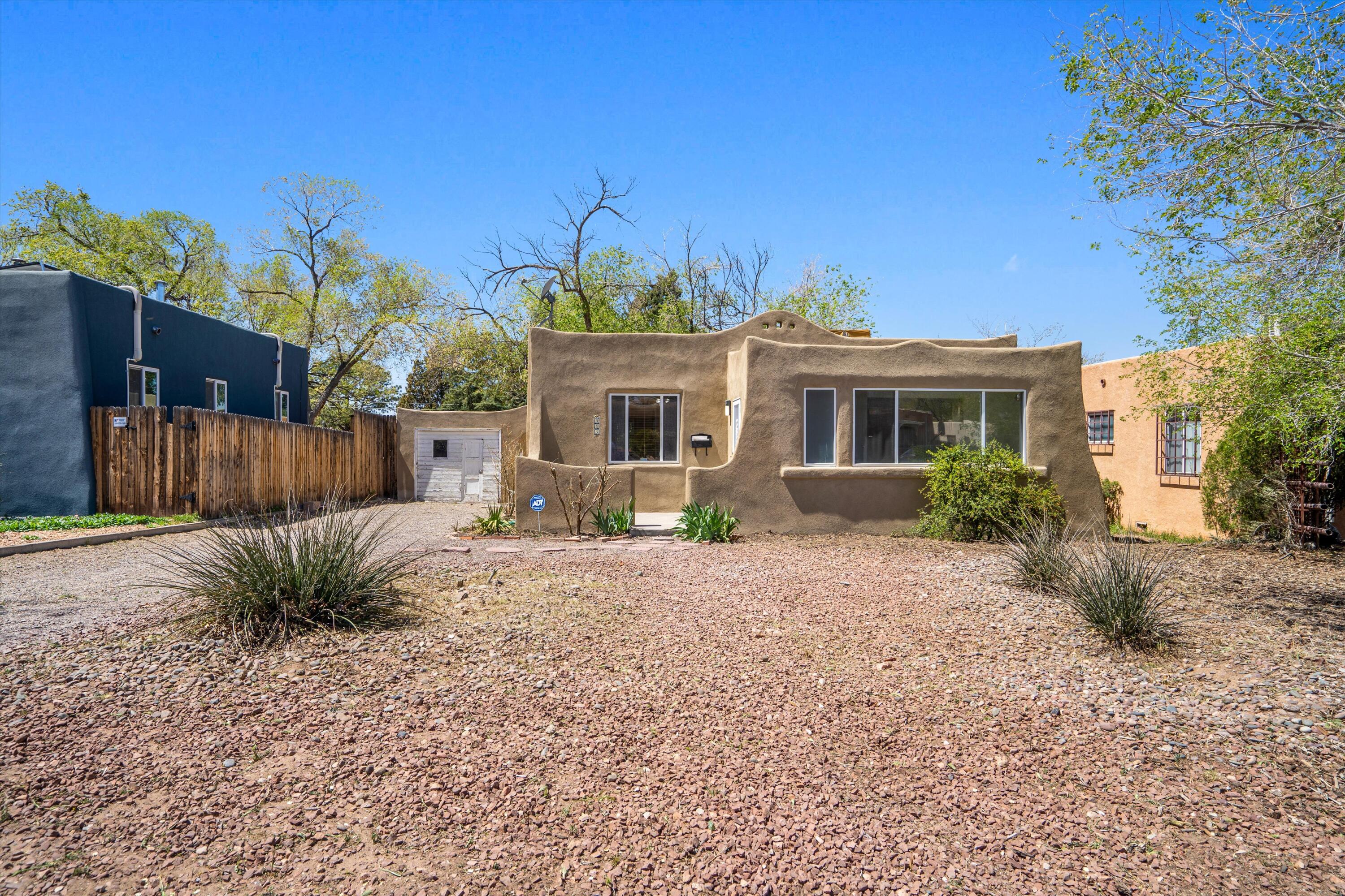 Welcome home to this beautiful Knob Hill / UNM area home!  Featuring, new stucco, hardwood floors, fresh paint, fireplace, gas stove, two living areas, ceiling fans, one car garage and large yard!