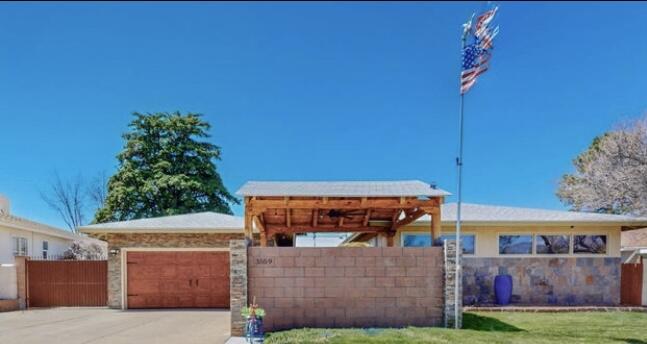 Come see this beautifully remodeled Mossman home in the heart of the NE Heights. This stunning 4 bed, 2 bath has many upgrades:SELLER OWNED Solar System, remodeled kitchen w/ beautiful cabinets & soft close doors, marble countertops & backsplash, gas range w/ copper hood, copper sink, remodeled bathrooms, upgraded Refrigerated Air, Minisplit, updated wood windows, porcelain tile in  kitchen & den, wood floors & doors, LED lighting throughout the home, fresh paint, new kitchen appliances, & much more. The private, tranquil & lush front courtyard has a Koi pond to enjoy the sunrises; the spacious backyard is great for entertaining, BBQ's & pets with dog run on the side. Garage has Electrical Vehicle Charger. Gated side access for RV's. Close to shopping, dining, schools, parks, I-25 & I-40