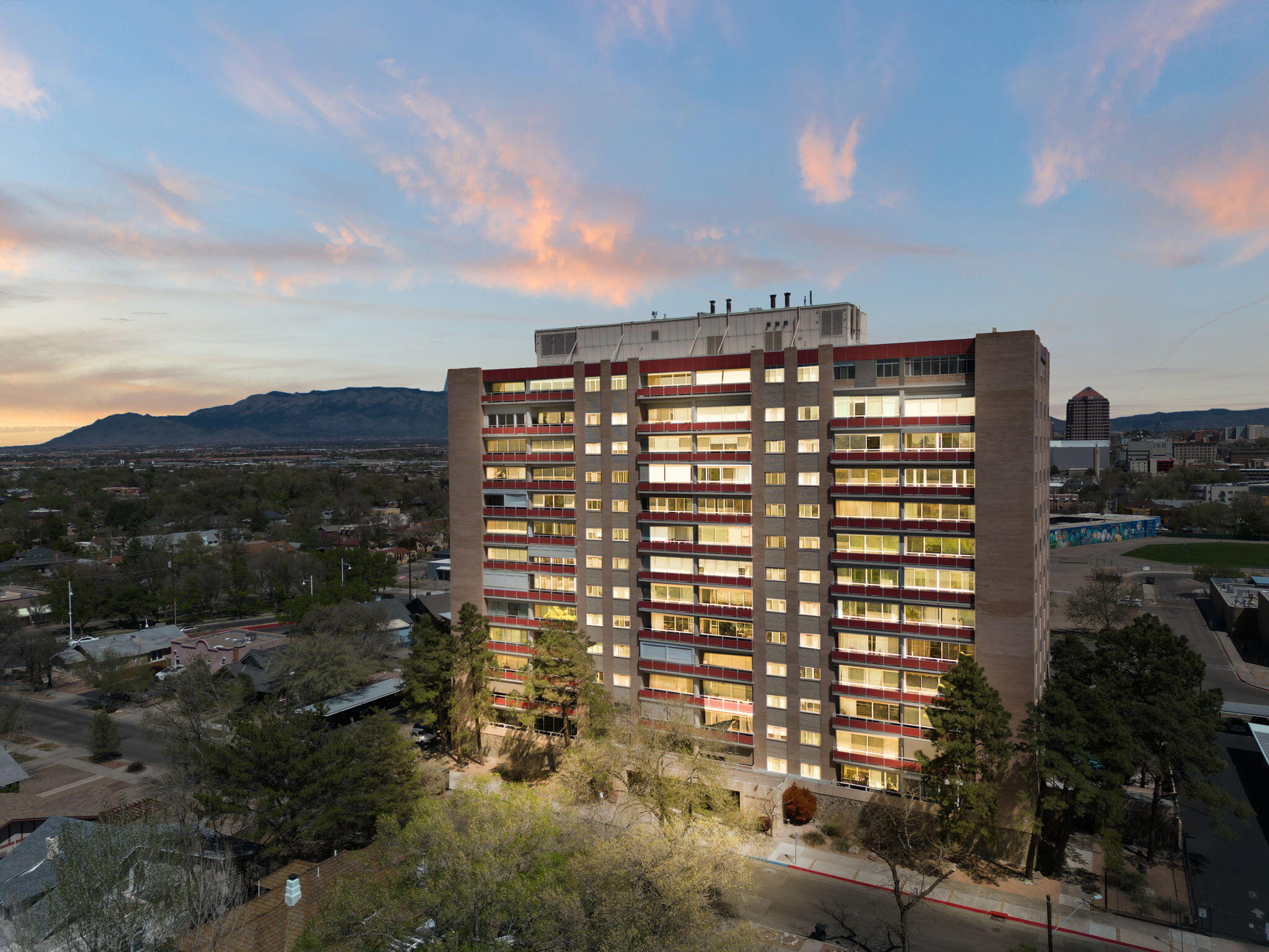 Beautiful Parkview condo located on the 8th floor, with stunning mountain and downtown views! This double unit features 1,461sf with 2 bedrooms and 2 bathrooms. Gated and covered parking. Take the elevator to the 8th floor. Step inside to find a spacious living area with upgraded laminate wood floors and a wall of sliding doors providing the perfect natural lighting and leading to the large covered patio! Spend evenings over looking the twinkling lights from downtown!  Kitchen with ample cabinet space, quartz island, built-in oven, cooktop, microwave, dishwasher and refrigerator. Two guest suites with bathrooms. Laundry rooms on every floor.  Heated swimming pool, Fitness center, technology center, conference center and more.  All utilities included with HOA.