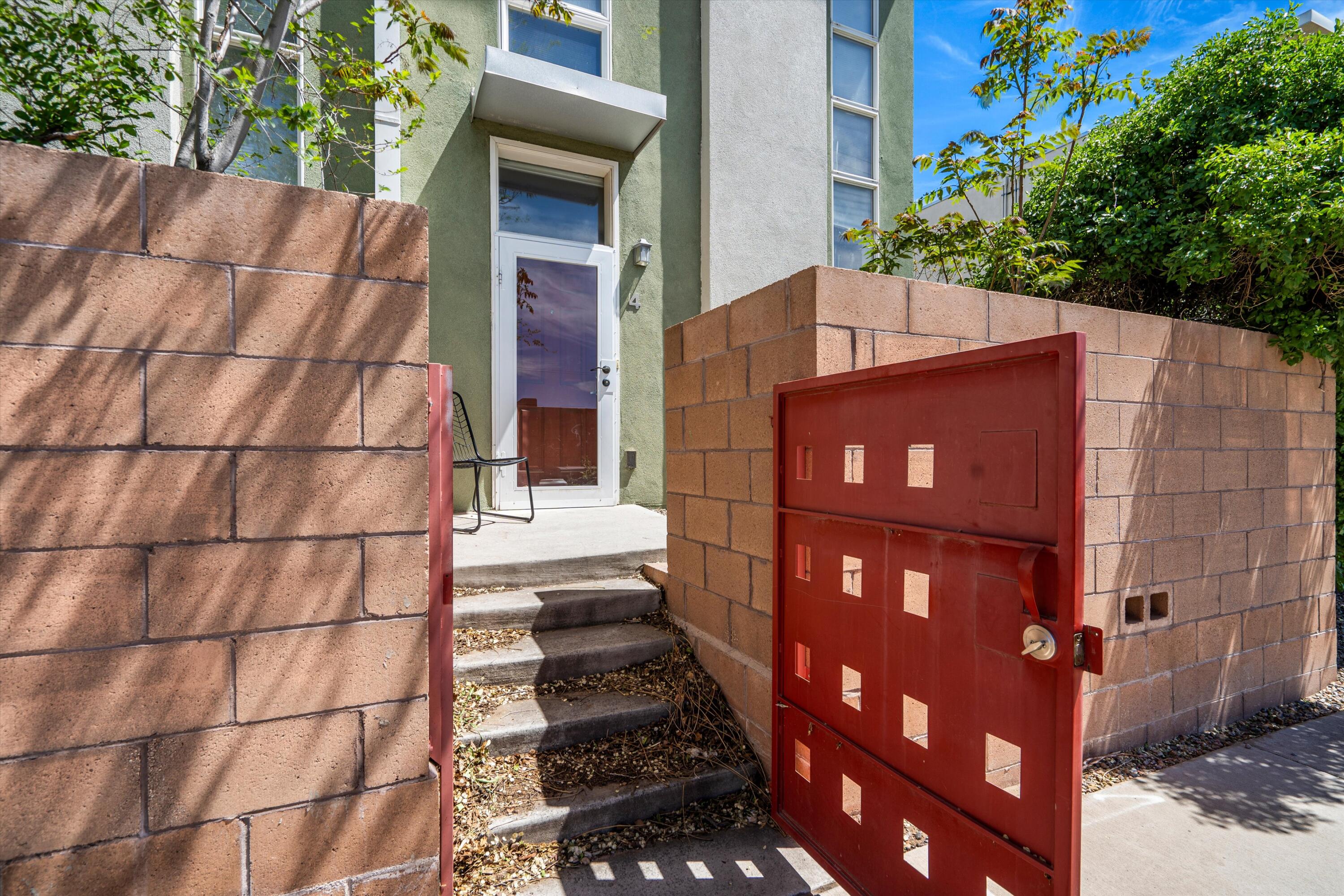 Welcome to 702 Broadway Blvd, where contemporary style meets urban living. This loft-style condo boasts wood-look floors and great kitchen appliances, creating a modern yet inviting atmosphere. Situated in a gated community in downtown Albuquerque, residents enjoy security and access to a beautiful community garden. With panoramic city views and upscale finishes, 702 Broadway offers the perfect blend of luxury and convenience. Schedule your showing today and experience the best of urban living!