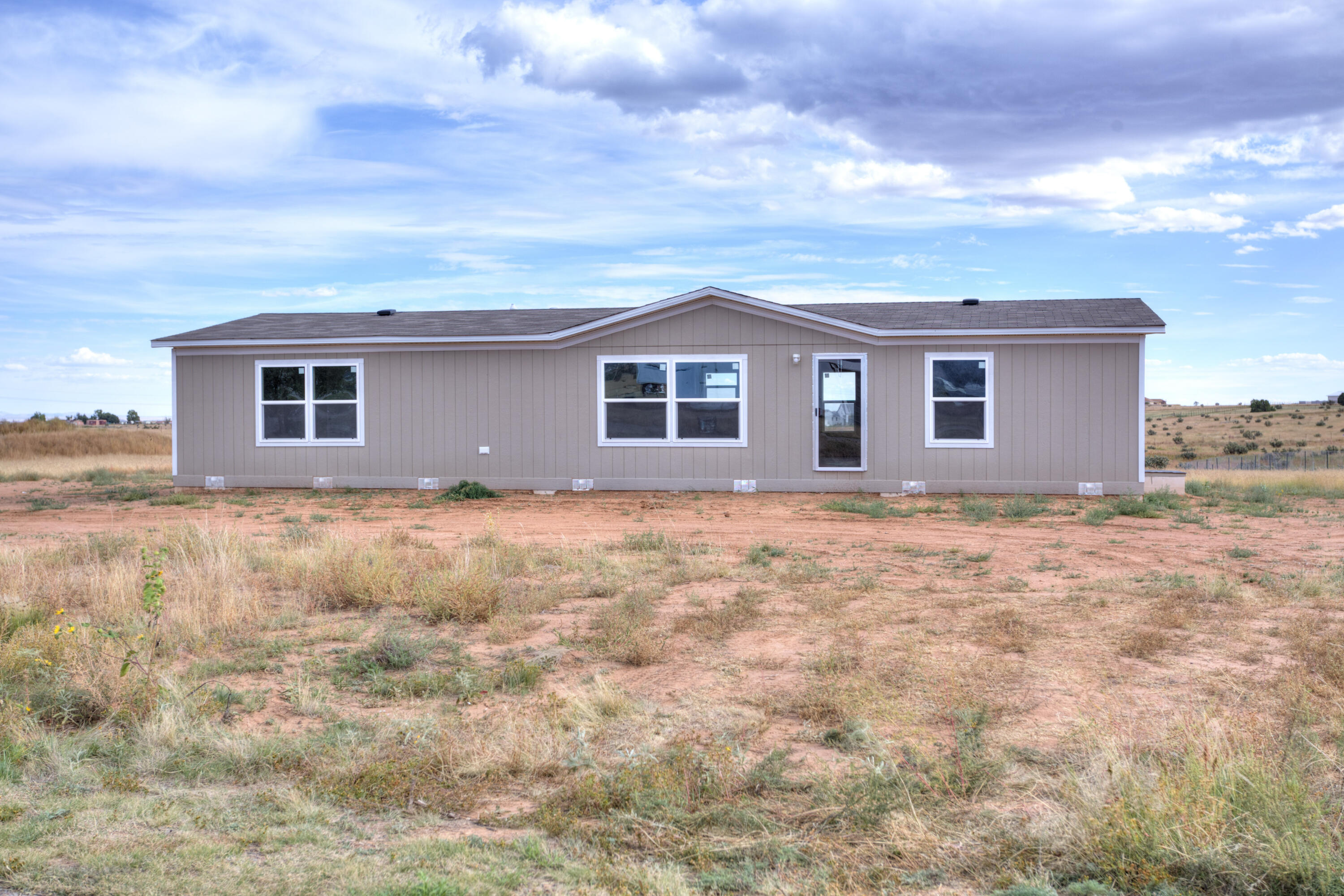 Welcome to Equestrian Park in Edgewood!  This 2022  manufactured home sits on one acre of land with a fenced backyard, community water, natural gas, and refrigerated air. Come embrace country living while still having the amenities of the city. Some photos are virtually staged to offer the potential of making this place truly feel like home.