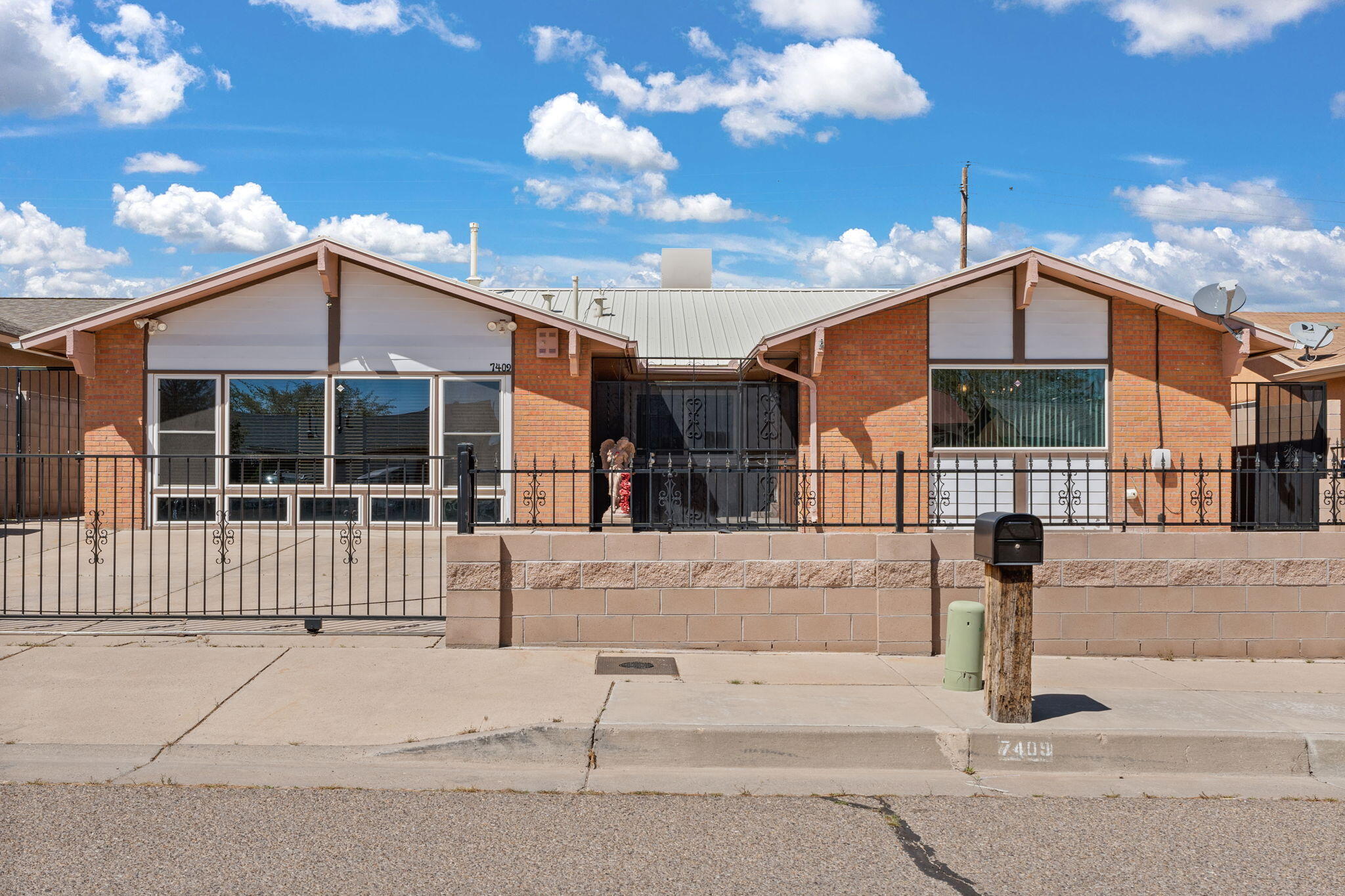 Step into the enchanting allure of this splendid 4-bedroom, 2-bathroom home nestled in the heart of Albuquerque, NM. Boasting over 2,000 square feet of meticulously crafted living space, this residence exudes a timeless charm with its captivating wood accents that adorn throughout. From the moment you enter, you're greeted by a warm ambiance that invites you to unwind and create lasting memories. The property offers a sense of security and privacy with its fully gated surroundings, ensuring tranquility and peace of mind. Don't miss the opportunity to make this haven your own, where comfort and elegance converge seamlessly. Welcome home to a sanctuary of serenity and style.