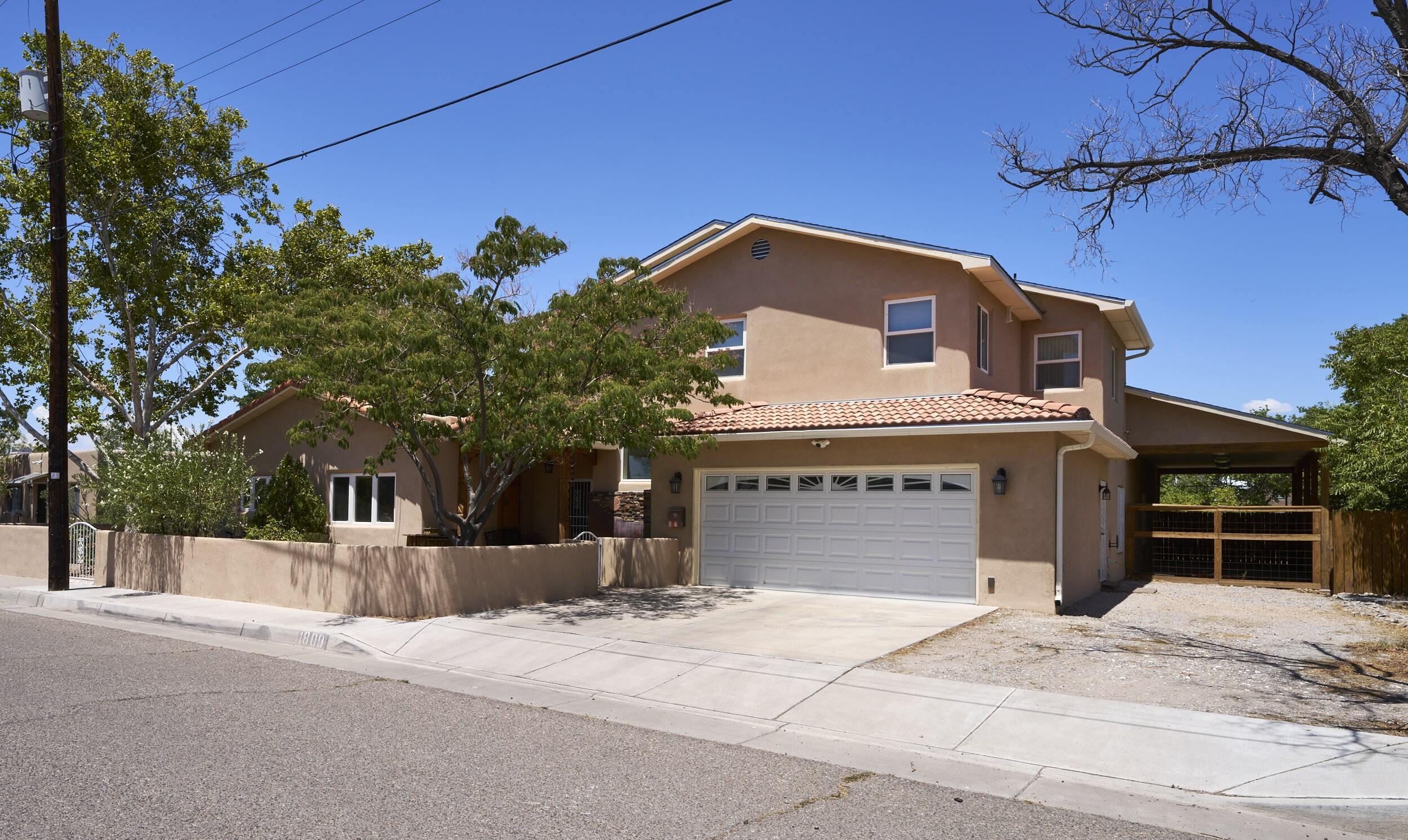 Welcome to this fabulous home available located in the highly sought after downtown area!  This home also provided supplemental income with the downstairs guest house space!  The long term vision was to create multiple short term rental options- inquire today for more information!  This home is designed with the beautiful pueblo style home New Mexico is known for!  These features include tongue and groove ceilings (latillas), kiva fireplace (in the master bedroom),custom tile accents and wood accents throughout.  There are multiple ways to access the outdoors in this home!  The backyard is very spacious and offers plenty of space for relaxing as well as entertaining.  This home offers many options for income producing opportunities!  Call today to schedule your own private viewing!