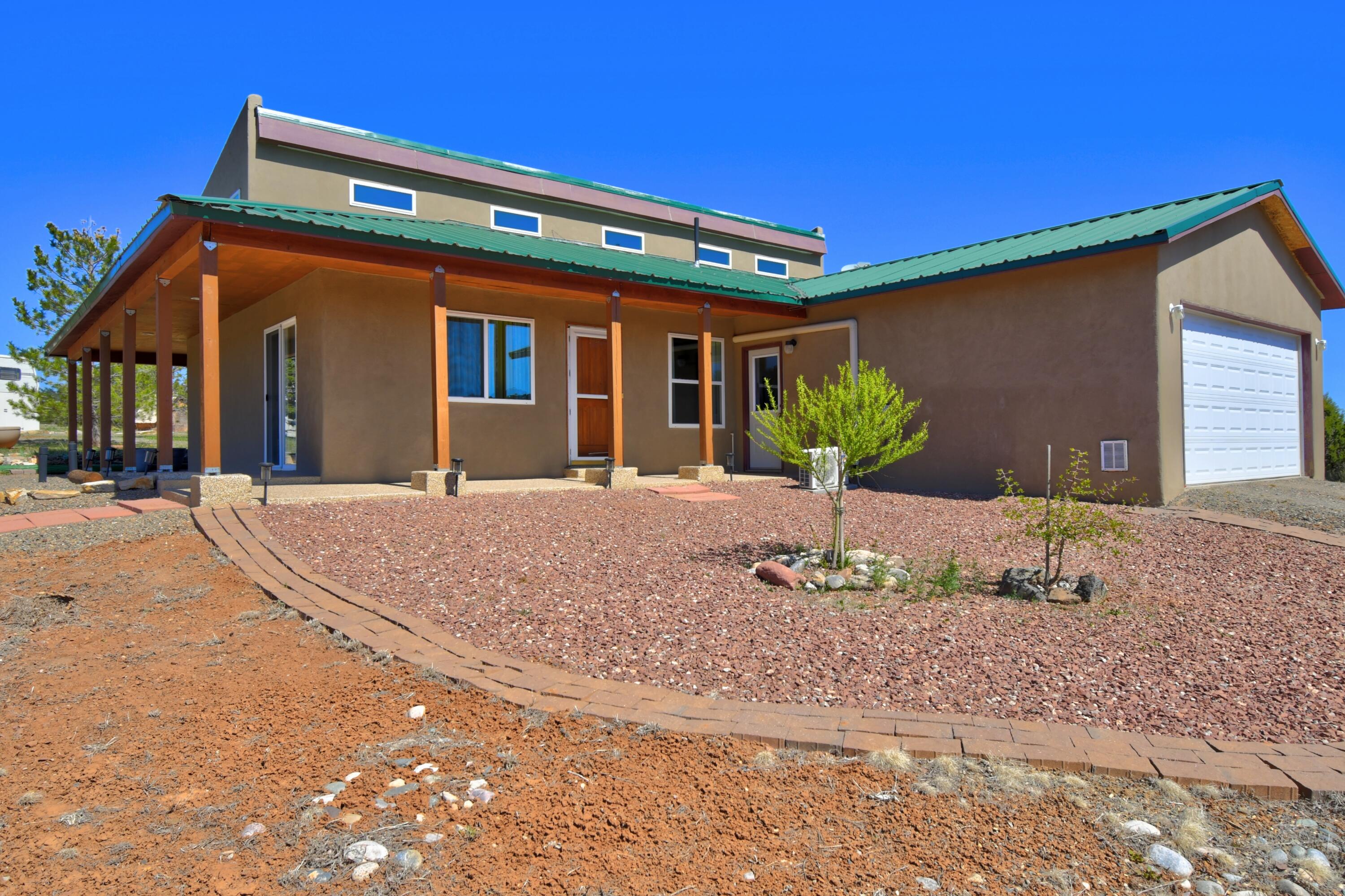 East Mountain Gem! The open concept design creates a spacious feel, with a Great room featuring vaulted ceilings. There's a separate dining room for formal meals. The primary suite boasts an ensuite bath with double sinks, a soaking tub, and a separate shower. The second bedroom has its own ensuite bath. The loft area adds versatility, potentially serving as a home office or flex space. The mini-split air-conditioning and heating system ensure comfort throughout the year, with customizable temperature settings for different zones of the home. The property is plumbed for radiant heat, offering an efficient and cozy heating option. Additionally, it's set up for a pellet or wood-burning stove for an additional heating option.  Updated stucco in 2023. RV parking with hookups. Schedule today!