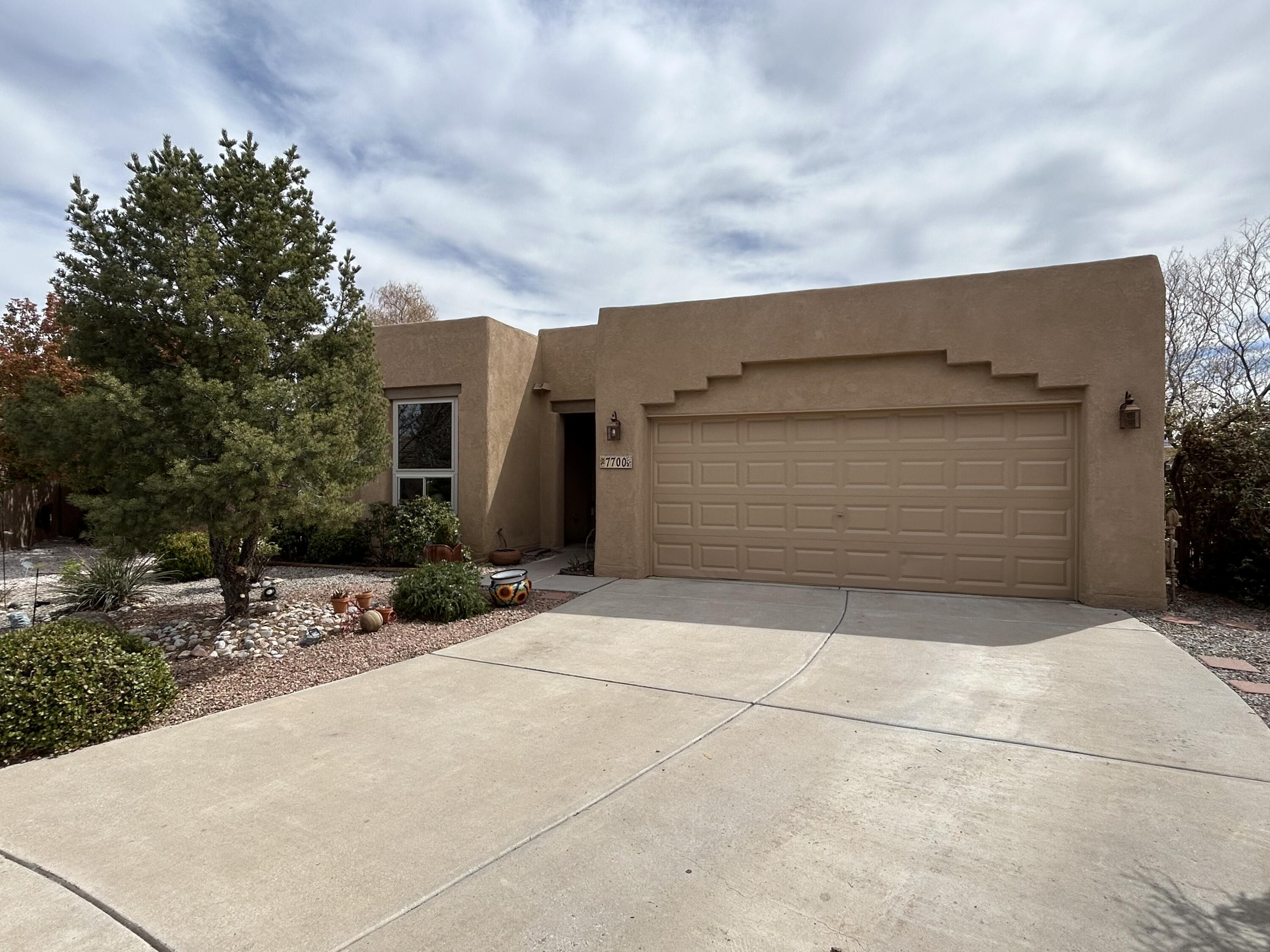 BEAUTIFUL YARD WITH VIEWS of the SANDIAS! This gorgeous 4 bed 2 bath single story home sits on the biggest lot at the end of a cul-de-sac in the highly sought after Vista del Norte neighborhood.  Original owner has taken wonderful care and added a few special touches such as radiant heat on a timer in the primary bathroom. Floating shelves and quartz countertops in the fresh and bright open kitchen. No carpet, only tile and laminate flooring for ease of care.  The entire home was  recently painted. The exterior was re-stuccoed and repainted New windows throughout, newer kitchen appliances, new water heater, roof has recently had maintenance with no concerns. The backyard has a huge covered patio and a separate pergola for the hot tub that stays! Do Not miss seeing this one!