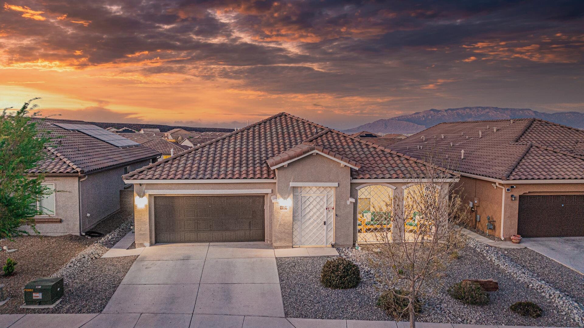 Discover luxury living in this spacious Pulte home in Mirehaven, offering breathtaking views of the Sandia Mountains and city lights. With 5 bedrooms, including an owner's suite and secondary suite, 3 full bathrooms, and an office, this home provides both elegance and functionality. Enjoy upgraded bay windows, an open kitchen with granite countertops and updated cabinetry, and outdoor entertaining spaces with covered porches. Additional features include a drip water system, dog run, security system, tile roof, and water softener/filter system.