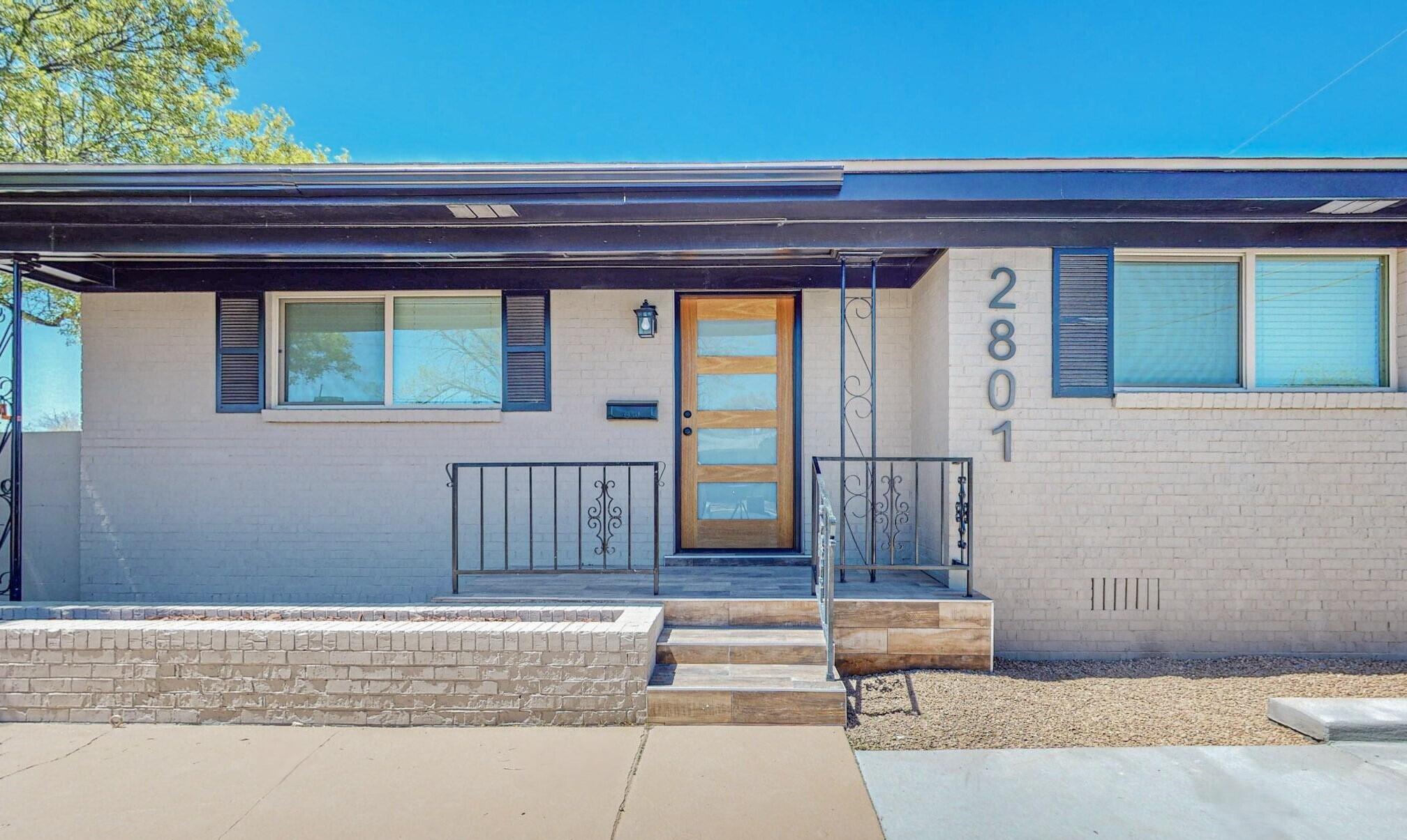 Beautifully updated contemporary home in great Uptown neighborhood. Features open concept plan w/tons of natural light, 2 separate family areas and a large wood burning fireplace. Modernized kitchen is equipped with stainless appliances, quartz counters, classic subway backsplash, tons of cabinets, and oversized center island. Two fully reimagined bathrooms feature custom floor-to-ceiling tile, floating cabinets and all new fixtures. New low-E thermal windows throughout plus new refrigerated a/c. Two separate full-size driveways ensure lots of off-street parking. Freshly xeriscaped front & rear. Central location is close to malls, dining, hospitals, services and more. Don't miss this fully turn-key home in the heart of Uptown, you'll want to move in right away!
