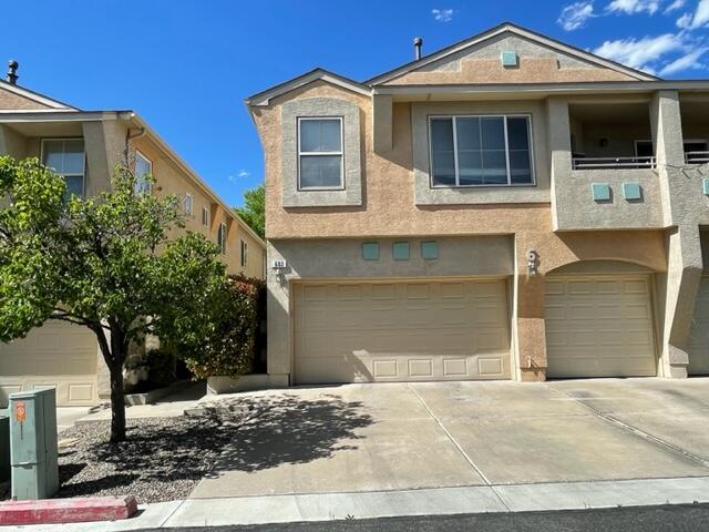 Don't miss this rare listing in the gated Louisiana Purchase complex.  Not far from Paseo giving easy access to both the  East and Westsides of Albuquerque.  This is one of the largest units in the complex with 1293 sq ft and a 2 car garage.  Upstairs are 2 bedrooms and a loft study with 2 full baths.  Downstairs is an open floorplan with living, dining and kitchen all open to one another.  There is also a 1/2 bath downstairs.