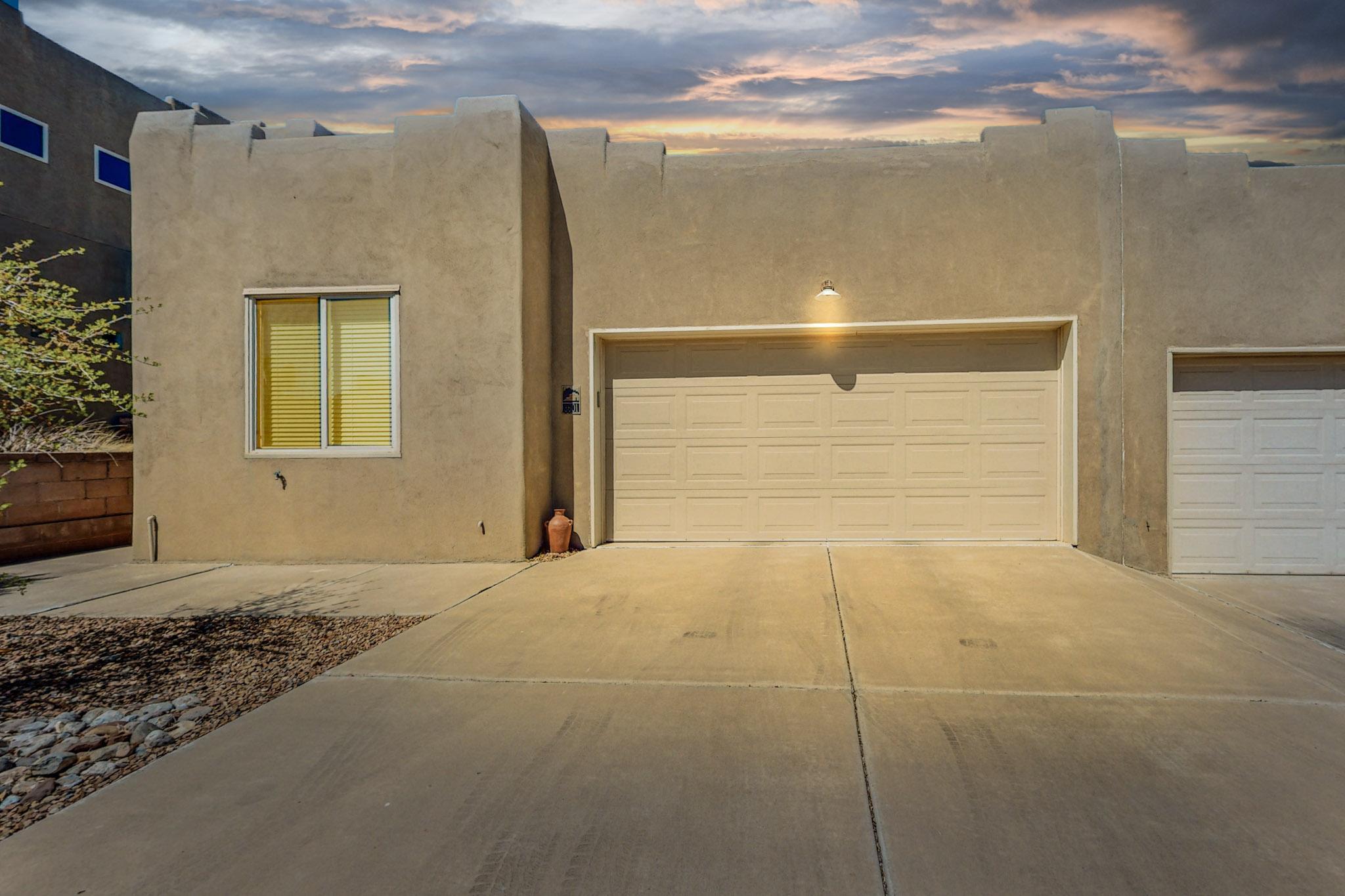 Beautiful pueblo style townhouse in the highly desired Las Casas Del Rio subdivision. Right next to the BOSQUE! Private access for homeowners in cul de sac to Bosque trails leading to the river. This 1311 sq ft home features a bright open floor plan with raised ceilings, charming kiva fireplace, and large sliding glass door leading to the private backyard. Hard floor all throughout, no carpet. Kitchen offers plenty of counter and cabinet space with pantry, tile backsplash, and all appliances stay. Water Heater, 2024. Master bedroom with full bathroom, double sinks, & large walk-in closet. Backyard has covered patio to relax surrounded by trees and blooming flowers, very low maintenance. Conveniently located near restaurants, grocery, banks, shopping, etc.