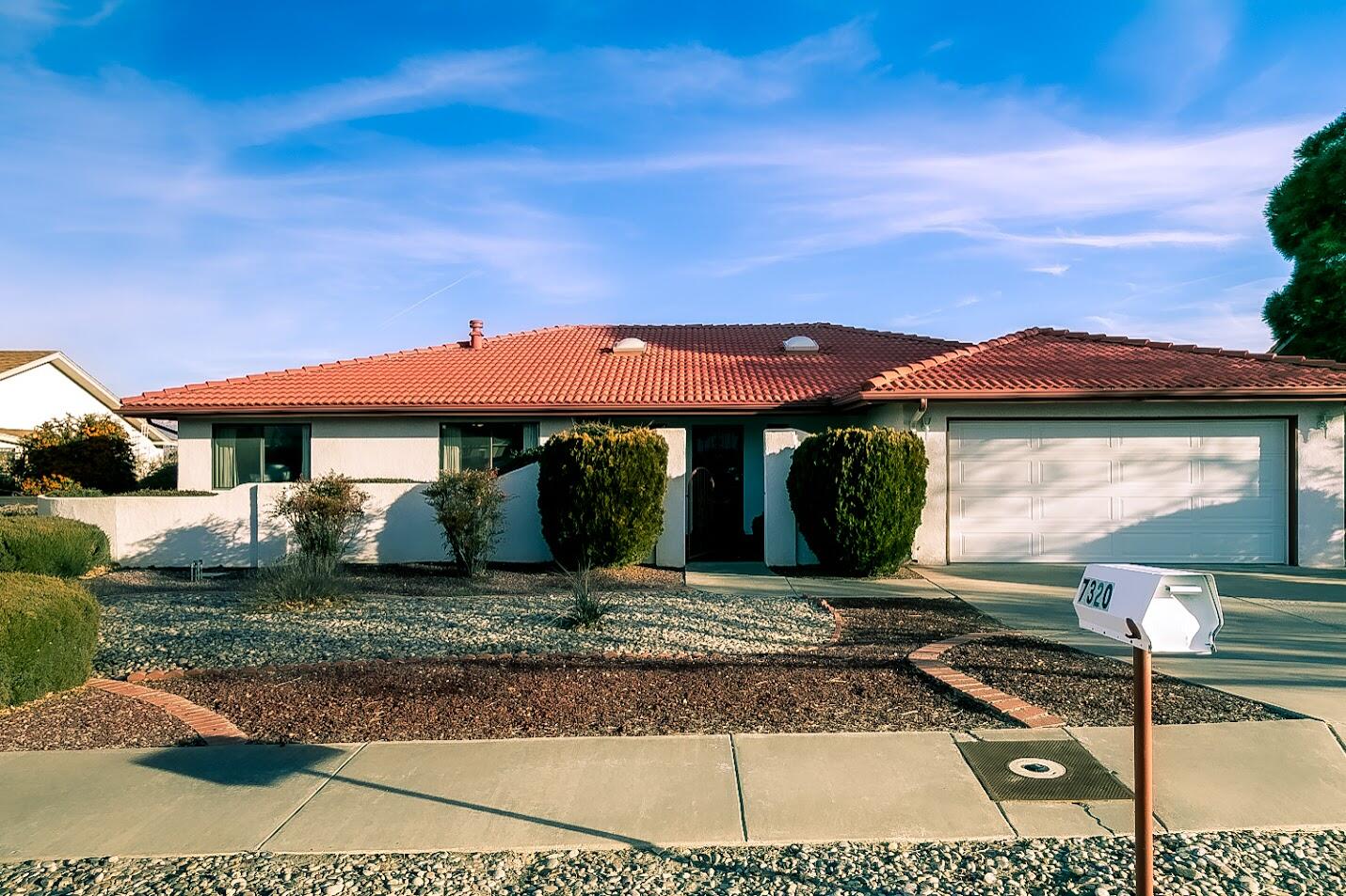 Beautiful custom home with great views of the Sandia Mountains. Vaulted ceilings in living room, Kitchen opens to living area and has additional dinning area. Sun room off main living area to enjoy views and sunny days. Sunroom is 243 SF adding lots of light to this great floor plan. Master bedroom has separate area for an office or exercise room. Home has 3 bedrooms, dinning room and 2 baths.  Great location to shopping, parks and easy access to East side of town.