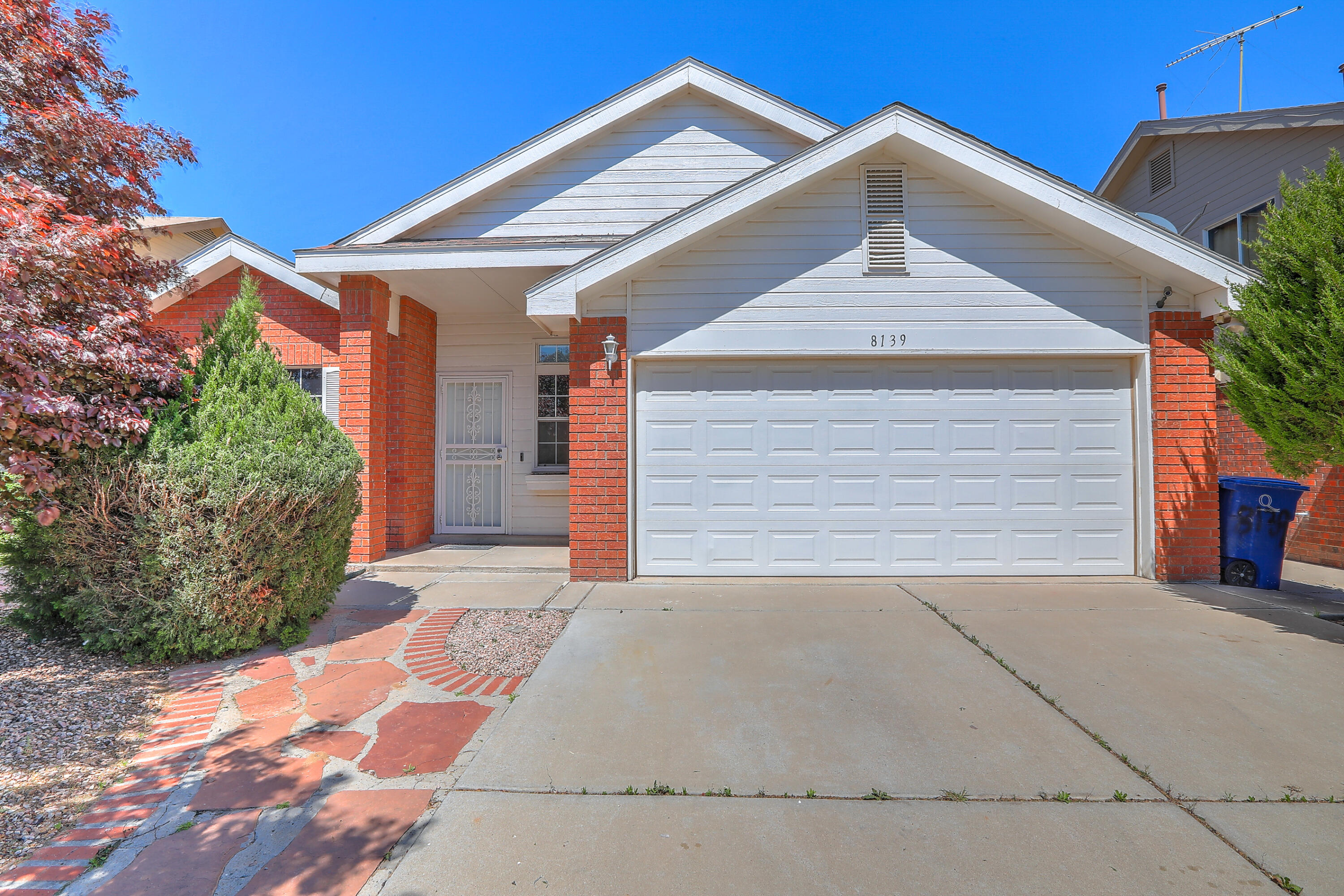 Competitively priced, cozy, brick home on a cul-de-sac in the Ladera Heights area. Featuring an open concept living room with vaulted ceilings and a fireplace. Cute kitchen with a breakfast nook. Full bath downstairs, along with two bedrooms, one with attractive French doors. Elegant wood spindle staircase leading up to the primary bedroom offering privacy with views of the Sandias and an en suite bathroom. Close to I40, shopping, dining, and more. Clean solar energy. See it, own it, and make it home!