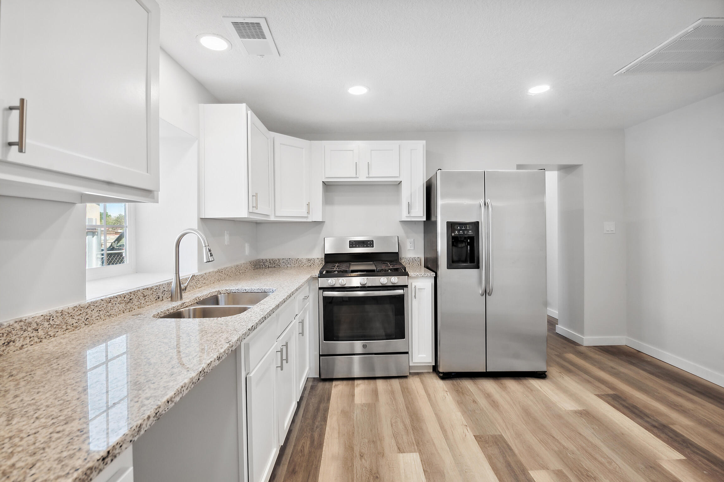 Checkout this beautifully remodeled home.NEW refrigerated air unit, paint, toilets, lighting, windows, cabinets, granite countertops,Luxury Vinyl plank floorings. Come see for yourself.