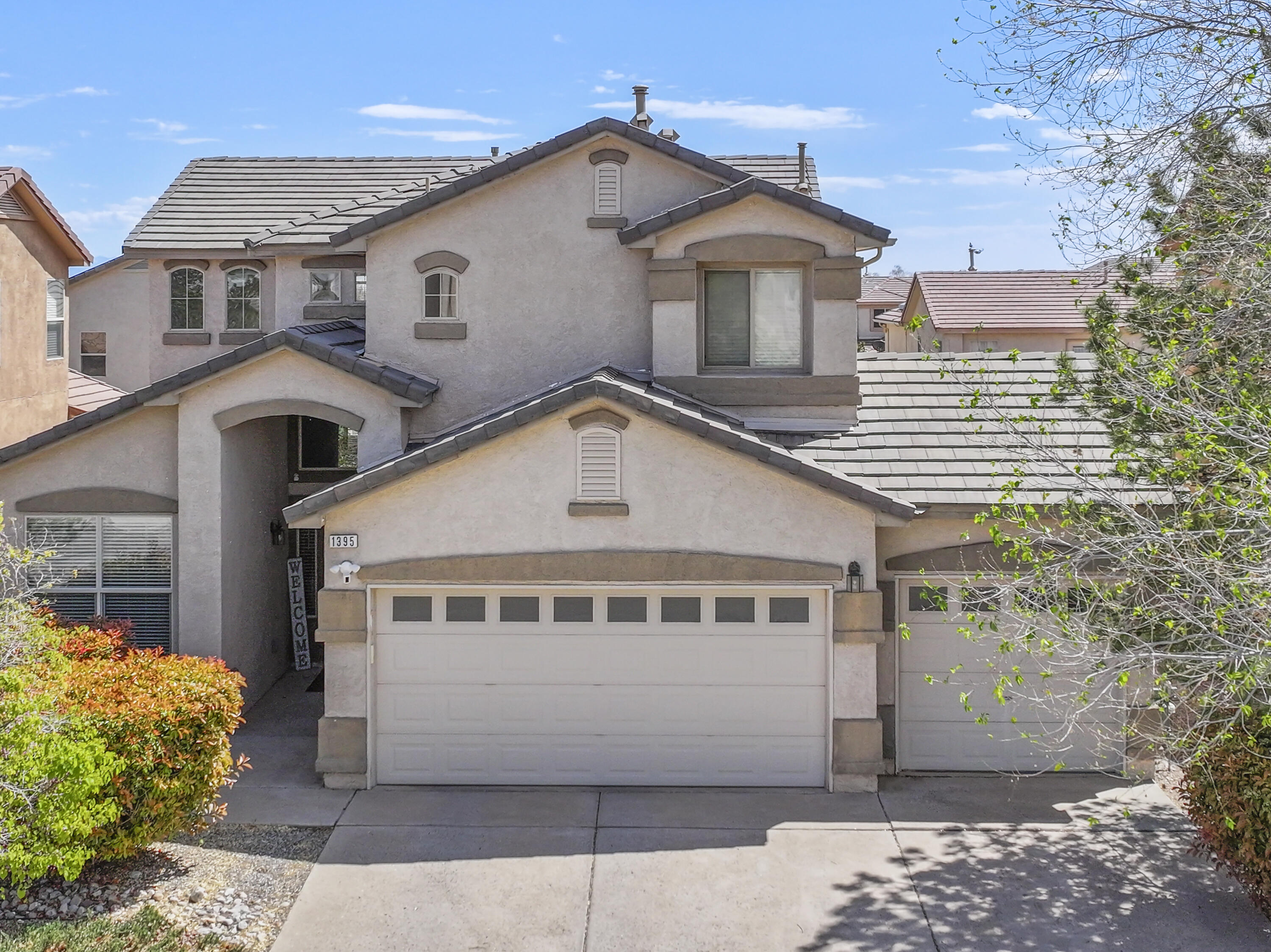 Welcome to this stunning DR Horton home located in the Astante neighborhood of Rio Rancho! This two-story gem boasts over 2200 sq. ft. of living space, featuring three bedrooms, three bathrooms, and a spacious three-car garage. Enjoy the open floor plan with high ceilings and abundant natural light throughout. The primary bedroom suite is conveniently situated downstairs, while upstairs you'll find a cozy loft with a patio, two bedrooms, and a full bathroom. Each bedroom is equipped with ceiling fans for added comfort. Step outside to the backyard oasis complete with a covered patio, landscaped yard, and a gas stub ready for your grill. Nestled on a quiet street, this home features a disposal that is just three months old, newer water heater, appliances, toilet downstairs, carpet, and