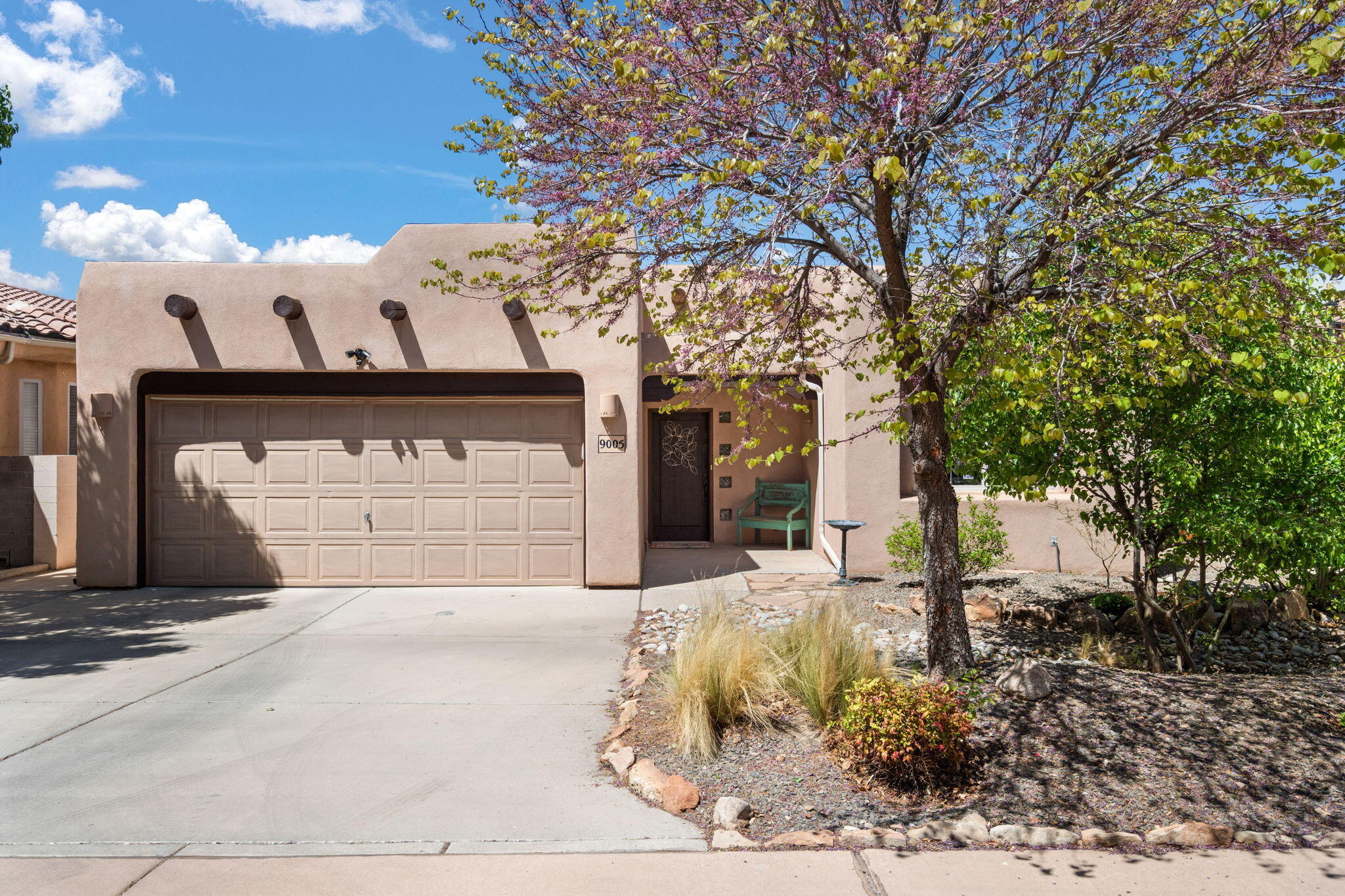 WOW! FANTASTIC OPPORTUNITY. This immaculate gem (Pueblo style) in the highly sought after Stone Brooke Estates with marvelous views of the Sandias is a true find! Over $35,000 in updates: New HVAC and Refrigerated air (2023), New Wood Laminate Floors (2023), New Hot Water Heater (2023) Roof with warranty and NO CARPET. Lots of natural light, private backyard, gas fireplace for those cool nights, huge walk in closet, quiet street, updated baths and even a doggie door!  Washer and dryer stay. Pride of ownership evident throughout! Located with easy access to Paseo, I-25, restaurants, grocery stores, A+ school districts & just blocks from Domingo Baca Park and Multicenter with new public pool underway.