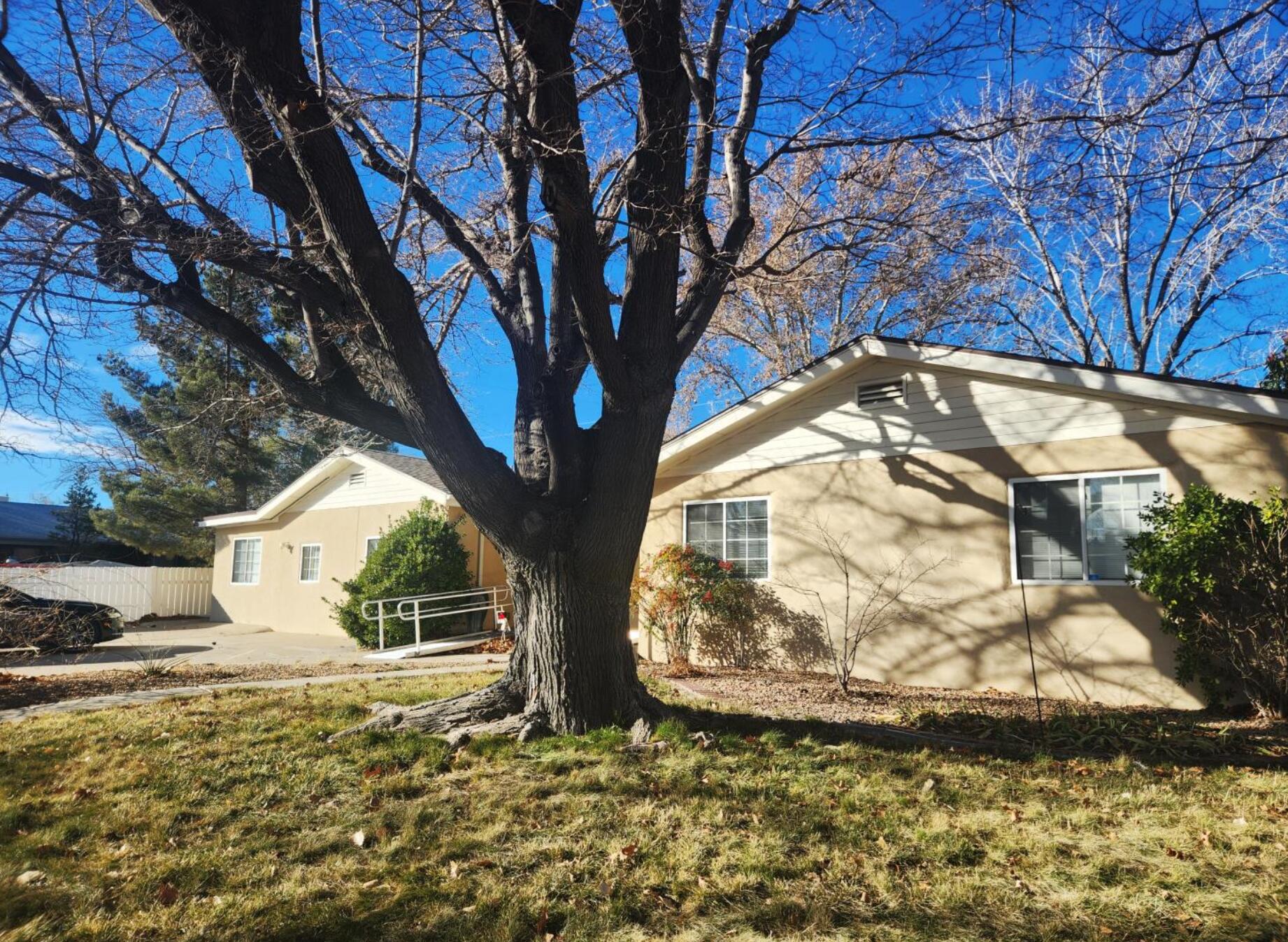 Seven bedroom house with 2 and a half baths, 2 living areas, large kitchen and dining situated in prime Northeast Heights location. Yard has wheelchair ramp, two patios, fruit trees, storage, and more in this lovely Mossman Home built in 1958.