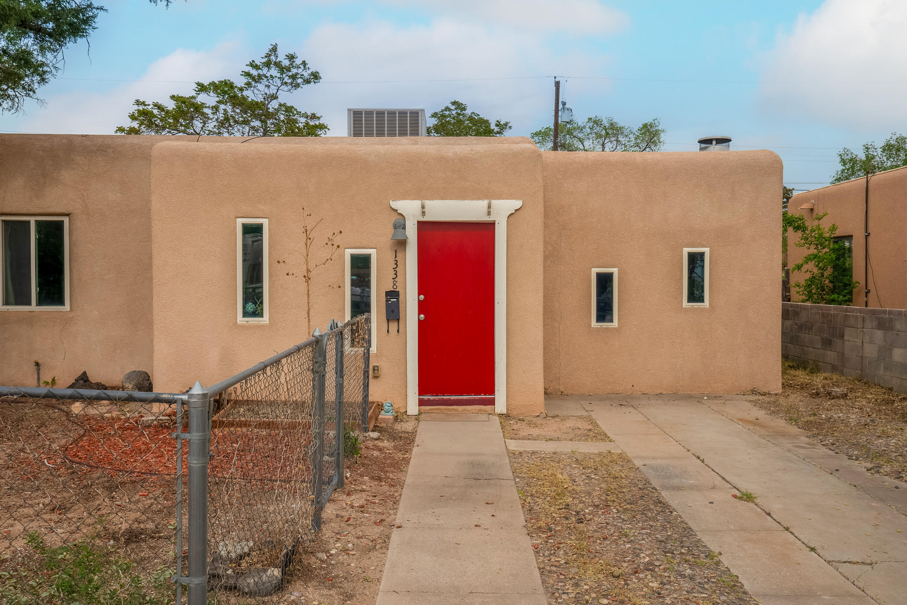 Super nice classic UNM area home. Traditional hardwood floors with tile in kitchen, bathroom, & utility room. Ceiling fans are in the bedrooms and living area. Don't miss cozy fireplace for those chilly winter nights!.  The large entry has room for an extra desk, bench, hall tree, etc! There's a good sized utility room. The large backyard hosts a nice spot for a fire pit.  It also has an open patio to dine on, and it provides an extra gathering place to enjoy friends and family.  Close to UNM and Montezuma ElementarySchool.  Don't miss the new Whole Foods Market at Carlisle and Indian School. Wow!