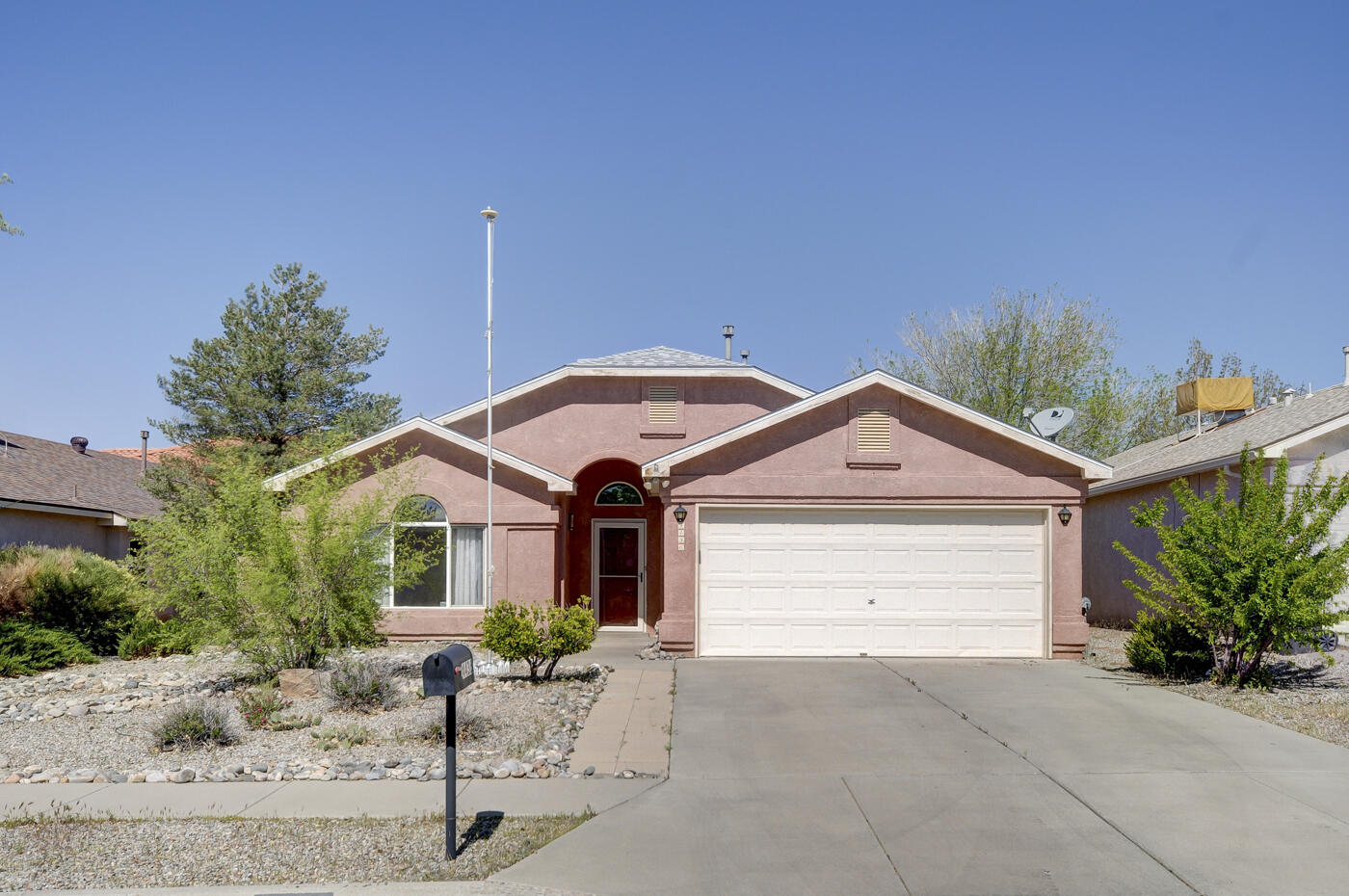 Experience Comfort & Style in this Rio Rancho home! Open floorplan connects a spacious great room with sunny kitchen with ample cabinetry/stainless steel 5 burner gas stove! The wood-look ceramic tile floors create a warm and modern ambiance, seamlessly connecting the living spaces! Owner's suite offers a soaking tub/separate shower/walk-in closet! Great room features a gas log fireplace and decorator shelving, while solar tubes bring in natural light! The upgraded lighting throughout adds warmth to the atmosphere.Three bedrooms provide ample space for family or guests with separated Owner's suite! Enjoy dining on your covered patio in the inviting rear yard!  The garage includes a new spring system, built-in cabinetry for a workshop, and a newer WH!  Near Intel, South Rio Rancho!