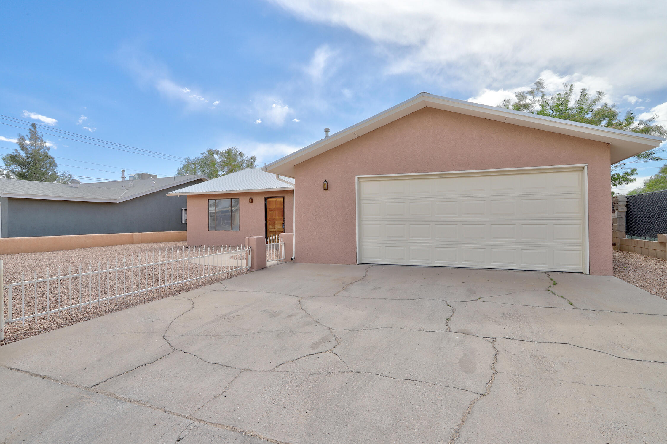 This Spacious 4 bedroom 2bath home boasts 2 living spaces, a great floorplan and many updates! The kitchen has new butcher block counter tops and opens to the den with a cozy fireplace! The huge lot offers backyard access with room for all your toys and inviting covered and open patios ready for out door fun & BBQ's! This Move in Ready home has just been freshly painted,  has new laminate flooring and carpet! Close to restaurants, shopping and parks! Come see today!