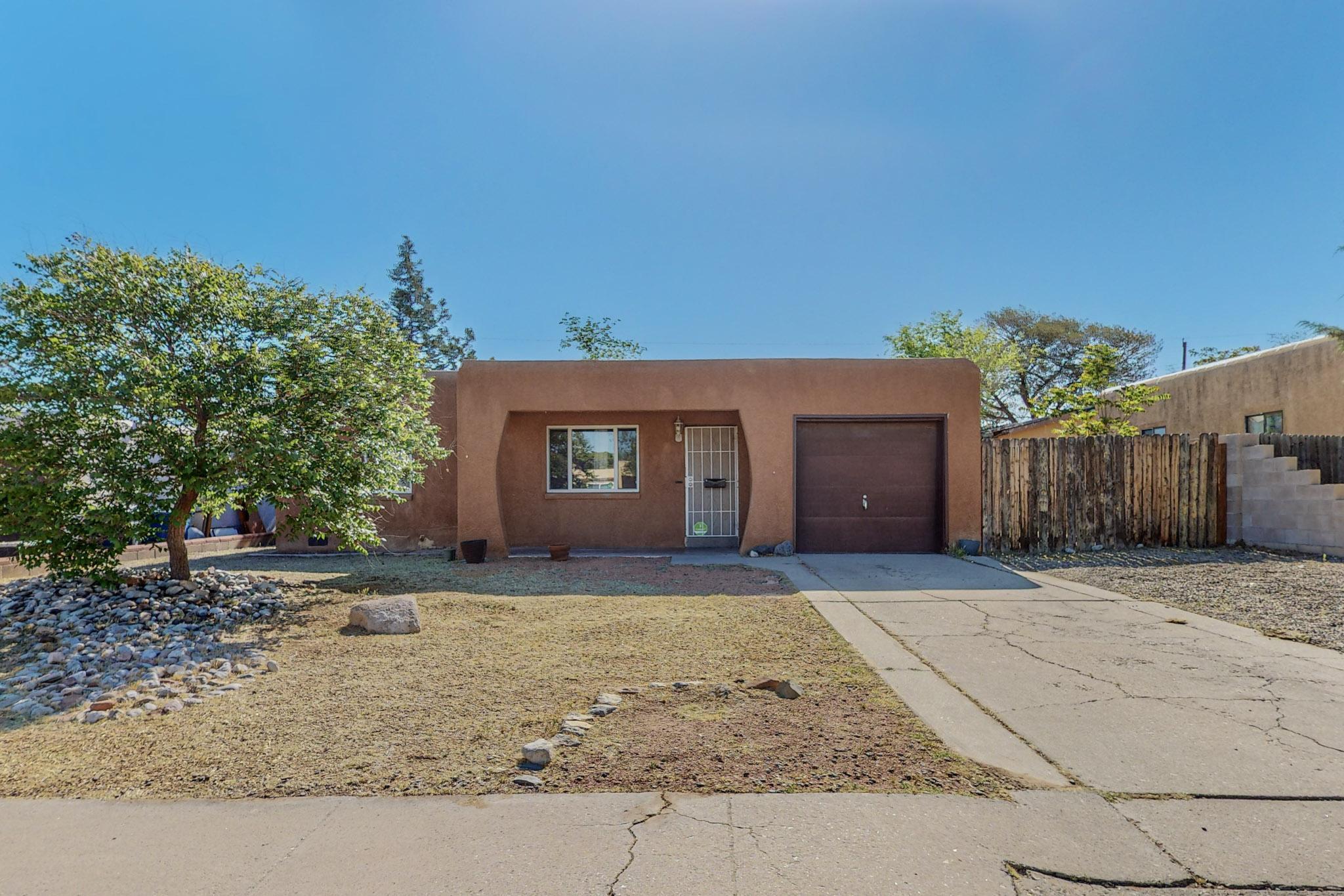 Cute-as-a-button! This charming 2-bedroom, 1=bath home boasts a spacious lot, refinished hardwood floors, and a fresh coat of paint throughout.  Stay comfortable year-round with the split unit heating and cooling system. Lovely central location with many restaurants and shops nearby!