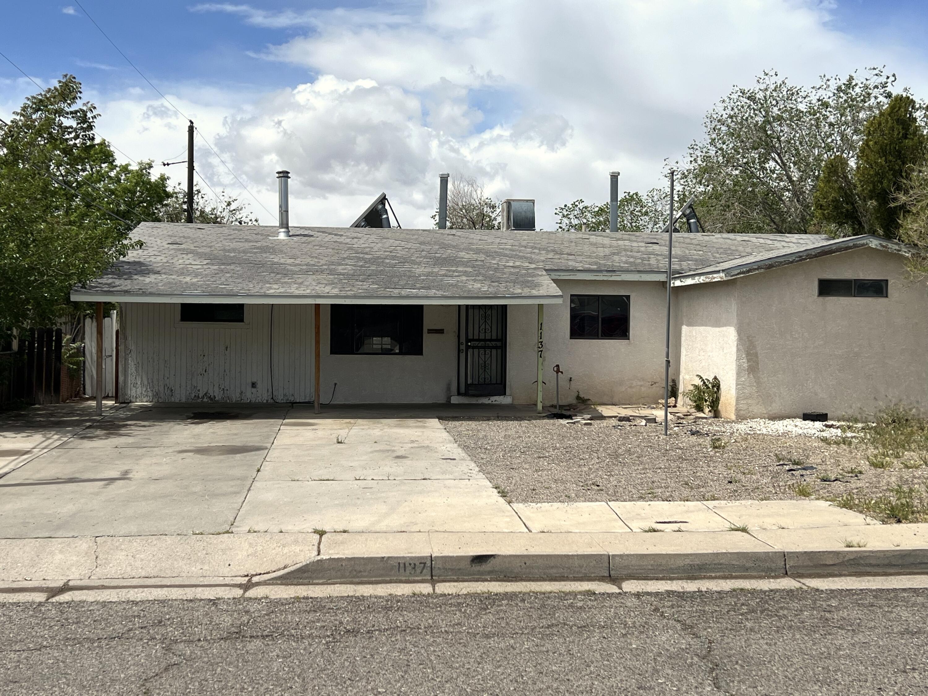 Discover the potential in this 3-bedroom, 2-bathroom home nestled in Albuquerque's desirable Northeast Heights. Although it requires some TLC and creative vision, this property is a fantastic opportunity for those ready to customize their dream home exactly the way they want. Offered ''as-is,'' this home appeals to DIY enthusiasts and investors alike, located near schools and amenities. Embrace the chance to transform this house into a stunning residence or a lucrative investment in a prime location.