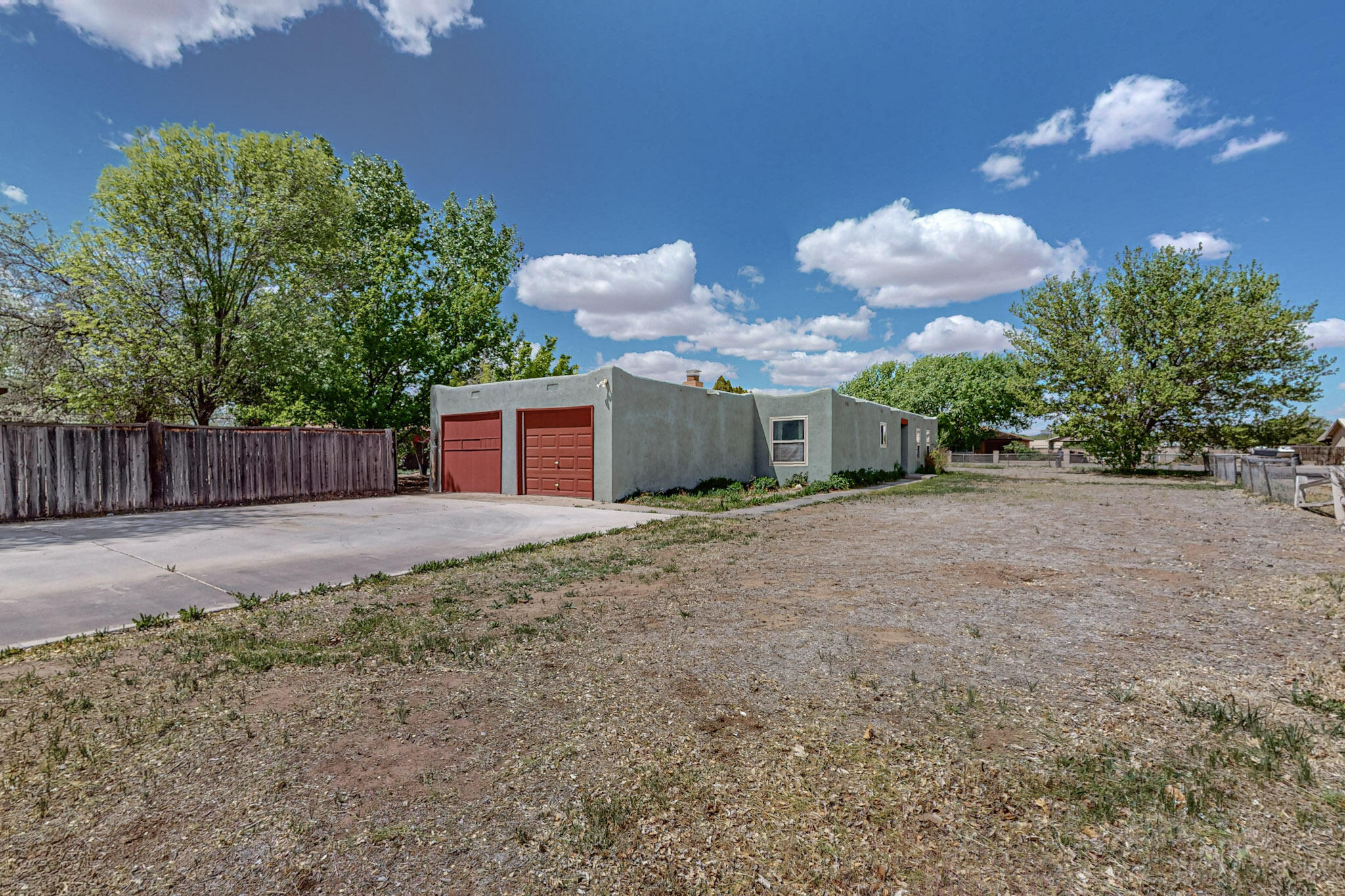 This New Listing is a Absolute Hidden Gem! Nestled in a Quiet Neighborhood in Los Lunas, while still close to Shopping and Restaurants, this home is Featuring Fabulous Fruit Trees on Over a Half Acre of Land, a Bonus Two Car Garage, Additional Storage Sheds and Lots of Space for Privacy and Entertainment! It also has a Private Well, an Irrigation Well and Septic Tank. Inside you will find a Custom Wood-Burning Fireplace, a Spacious Living Area, Walk-In Closet in the Main Bedroom and a Kitchen bosting Lots of Cabinet Space with an Oven that doubles as an Air Fryer for all your Culinary Adventures. This Property has Tons of Potential and Opportunity to Make it Your Own! Do Not hesitate, Schedule Your Showing Today!