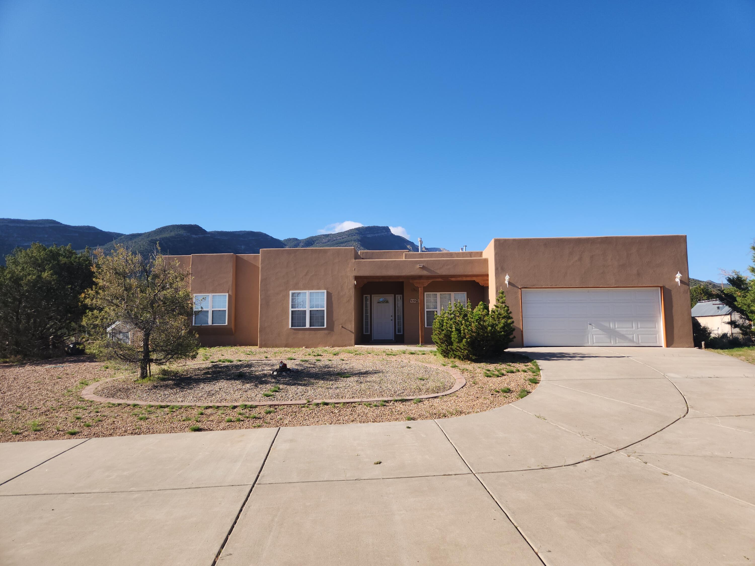 3 BEDROOM WITH EXTRA WORKSHOP/GARAGE! $660,000. Quiet location, convenient to Highway 165, this 3 bedroom + office is move-in ready! New kitchen appliances and new tile & carpet! Single level 2,315 sq ft home, with Sandia views from living, dining, breakfast nook, kitchen & primary bedroom. Southwest style home with (attached) 2 car garage + 971 sq ft (detached) workshop/3 car garage - great for artists, car enthusiasts, storage, etc! Comfortable floor plan with office (and half bath) just off the front entry. Primary bedroom has walk-in closet. Skylights give this home wonderful natural light! Gas log fireplace in the spacious living room and pellet stove in dining. Brand new septic tank. Less than a 1/2 mile from Hwy 165 & only a 20 minute drive to Albuquerque! No covenants & no HOA!