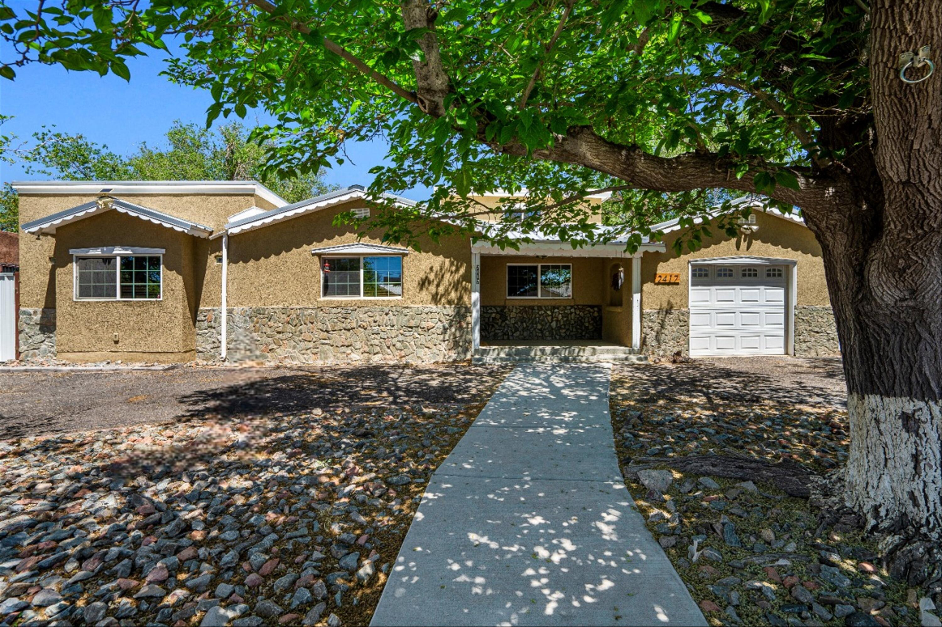 Discover the beauty of this uniquely charming North Valley home! From the captivating granite counters to the durable metal roof, every detail exudes elegance. Situated on a spacious 0.23-acre lot with backyard access, this home offers endless possibilities. Retreat to the luxurious master suite, a peaceful oasis separate from the other bedrooms. Ascend the spiral staircase to the 4th bedroom ensuite with walkout deck. The home also boasts a large flex room, potential 5th bedroom. The outdoor area is an entertainer's dream, featuring a pool and hot tub, perfect for unwinding after a long day. Designated with R-ML zoning this property is stubbed for utilities to allow for future expansion, as an in-law suite or casita. Don't miss this exceptional opportunity to own a truly remarkable home!