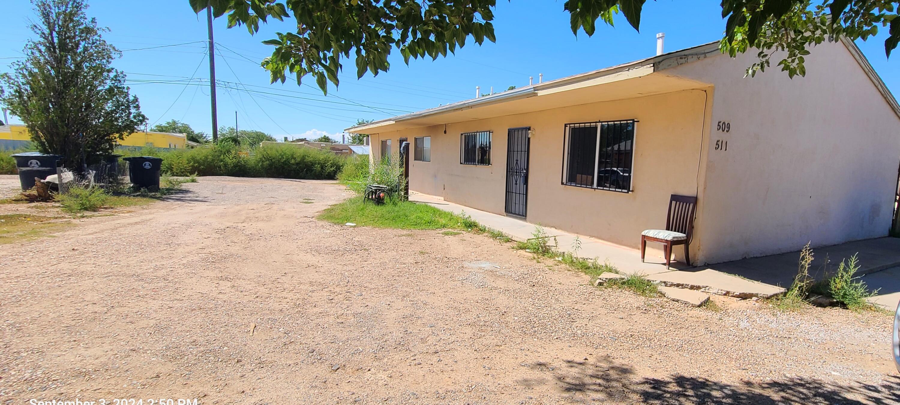 RENOVATION COMPLETE! Nestled in the heart of Albuquerque's vibrant International District, this duplex offers not just a residence, but a lifestyle tailored for both comfort & convenience. Each of the two units boasts 2 bedrooms, 1 bathroom, separate living rooms, large kitchens & W/D hookups too!. With a spacious layout of 788 square feet per unit, these homes are ideal for modern living. Tenants will appreciate the thoughtful amenities provided, including a covered patio and courtyard in front with a small but private backyard perfect for pets, children, or gardening enthusiasts. Off-street parking for up to 2 vehicles per unit ensures convenience for residents and visitors alike. Additionally, each unit is equipped with a storage room. >>>MORE>>>