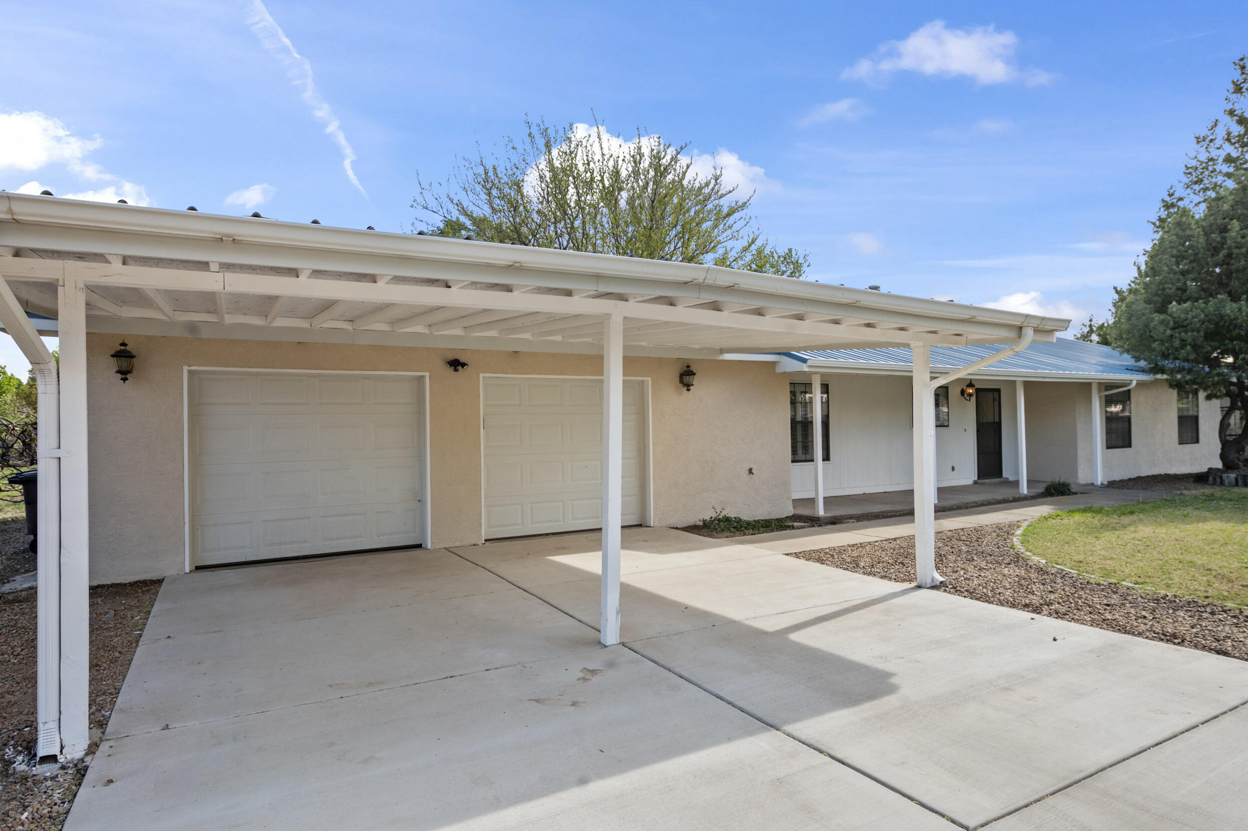 Nestled in the sought-after locale of Bosque Farms, this charming ranch house epitomizes peaceful living on a spacious half-acre lot. The kitchen, a chef's dream with stainless steel appliances and solid-surface countertops overlooking the front yard.  Kitchen bar and dining area have plenty of room for entertaining.  Spacious living room is open and bright with a cozy fireplace to keep you warm in the winter months. Custom shutters and new stucco.  It the backyard you'll find peace and tranquility complete with a covered patio and ample green space for outdoor enjoyment.Ideally located and well maintained, this ranch house embodies the essence of gracious living in Bosque Farms' desirable community. Come take a look today!