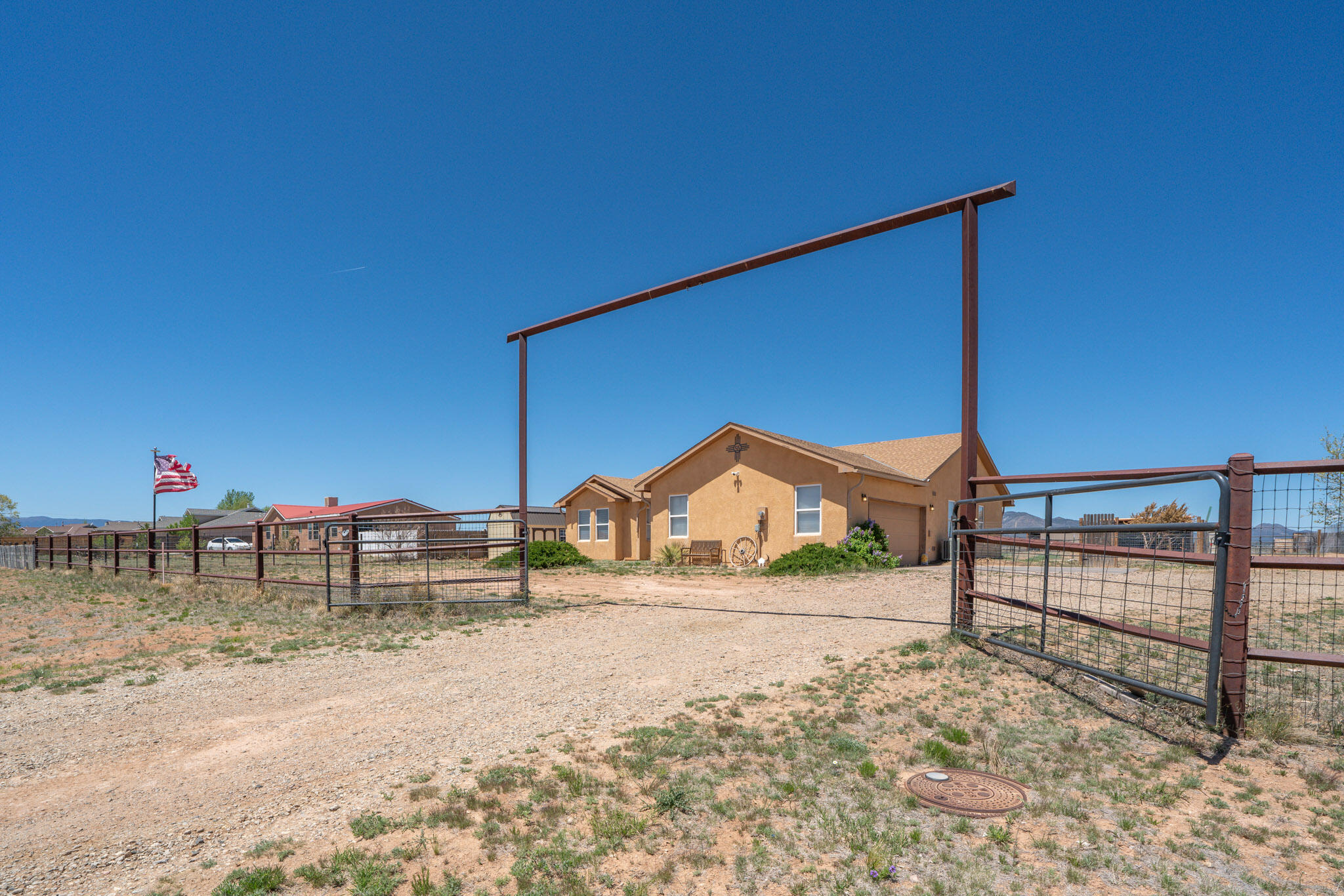 Beautiful MOVE-IN-READY home!! This property is fully fenced in with a gate, and offers 3 vet designed horse stalls! Step inside this bright functional floor plan and enjoy the new vinyl flooring and carpet throughout. The primary bedroom is oversized offering a large walk in closet and bathroom! The owners re-painted the entire house and have updated all of the light fixtures as well! Other notable features: New sink, New blinds, New storage shed, refrigerated air, and a Newer roof! Walk to the back yard and enjoy the unobstructed views and no neighbors behind the home! This country home offers paved roads, natural gas, and community water. Call today to make this special home yours!