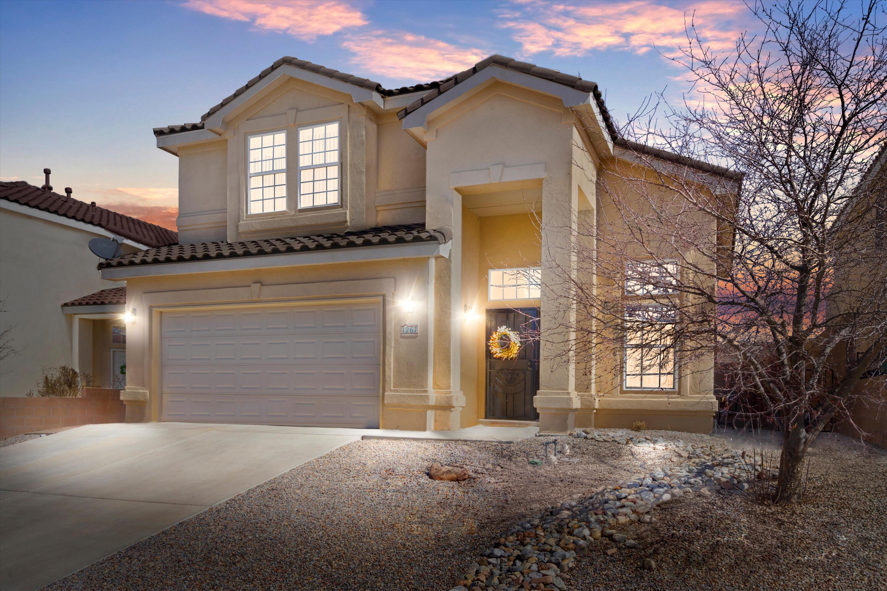 STUNNING 2 story in Rio Rancho! 4 bedrooms, 2.5 baths, and a 2-car garage, offering over 2400 sq ft of luxurious living space. Nestled in the desirable Mirador Del Sol subdivision, this home features 2+ living areas, including a gorgeous living room with high ceilings and accent walls, a formal dining area, and a cozy family room with a fireplace. The private kitchen is a chef's delight with granite countertops, a mini island, ample cabinet and counter space, perfect for entertaining. Retreat to the spacious master bedroom with a garden tub, separate shower, double sinks, and a walk-in closet, plus a balcony for relaxing evenings. Outside, enjoy the completely xeriscaped backyard with a covered porch, ideal for outdoor gatherings! Call today!