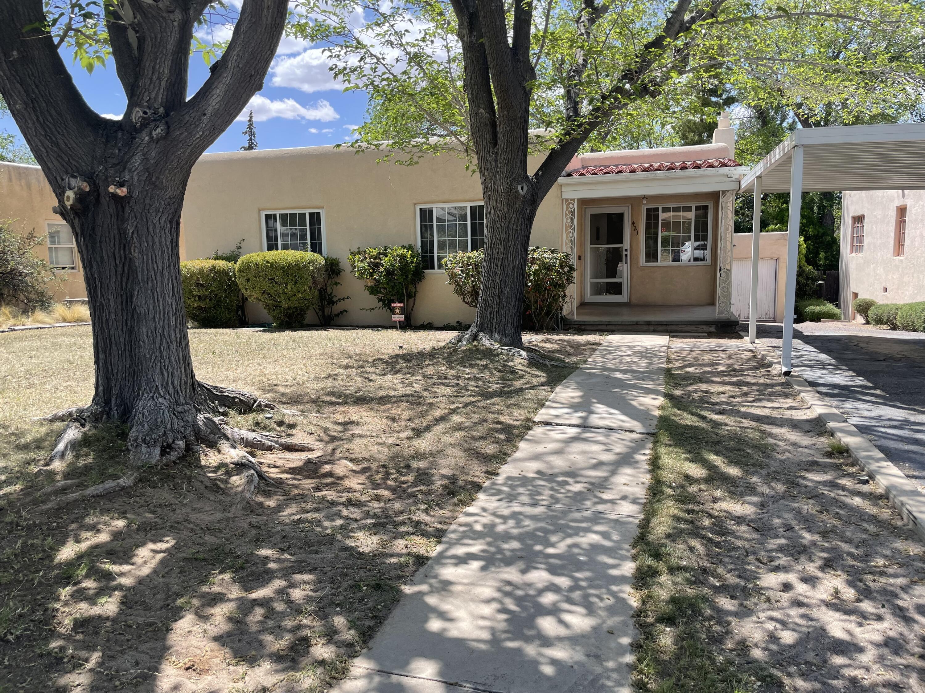 Great location near UNM, Airport and Hyder Park. Nice 2 bedroom home with 2 living areas, and an extra bedroom/office downstairs. Roof replaced in 2023, windows are newer vinyl double pane. There's a large backyard with lots of shade!