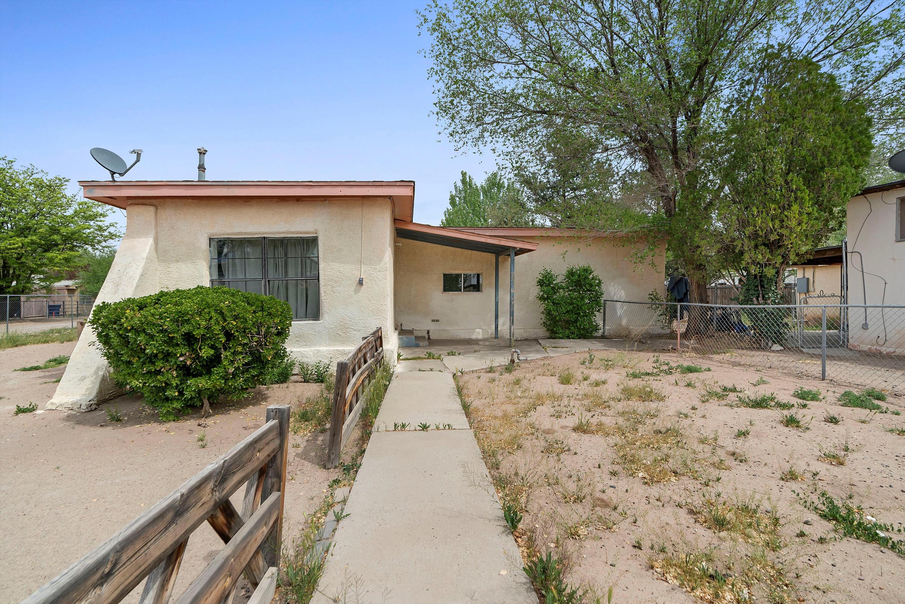 Nestled in Los Lunas, this property offers prime proximity to the Railrunner, ideal for commuters. A versatile investment, it boasts two homes on one plot, perfect for multi-generational living or rental income. The main house, 1385 sq/ft, presents 3 bedrooms, 1.5 baths, and awaits immediate occupancy. Each bedroom is equipped with heaters for personalized comfort. Meanwhile, the 970 sq/ft guest house features 1 bedroom, 1 bath, a full kitchen, and a spacious living area with laundry hookups. Enjoy the convenience of central forced air in the guest house. Recent upgrades include electrical service in 2021 and roof repairs in the same year, ensuring peace of mind for years to come. Don't miss out on this exceptional opportunity at an attractive price point!