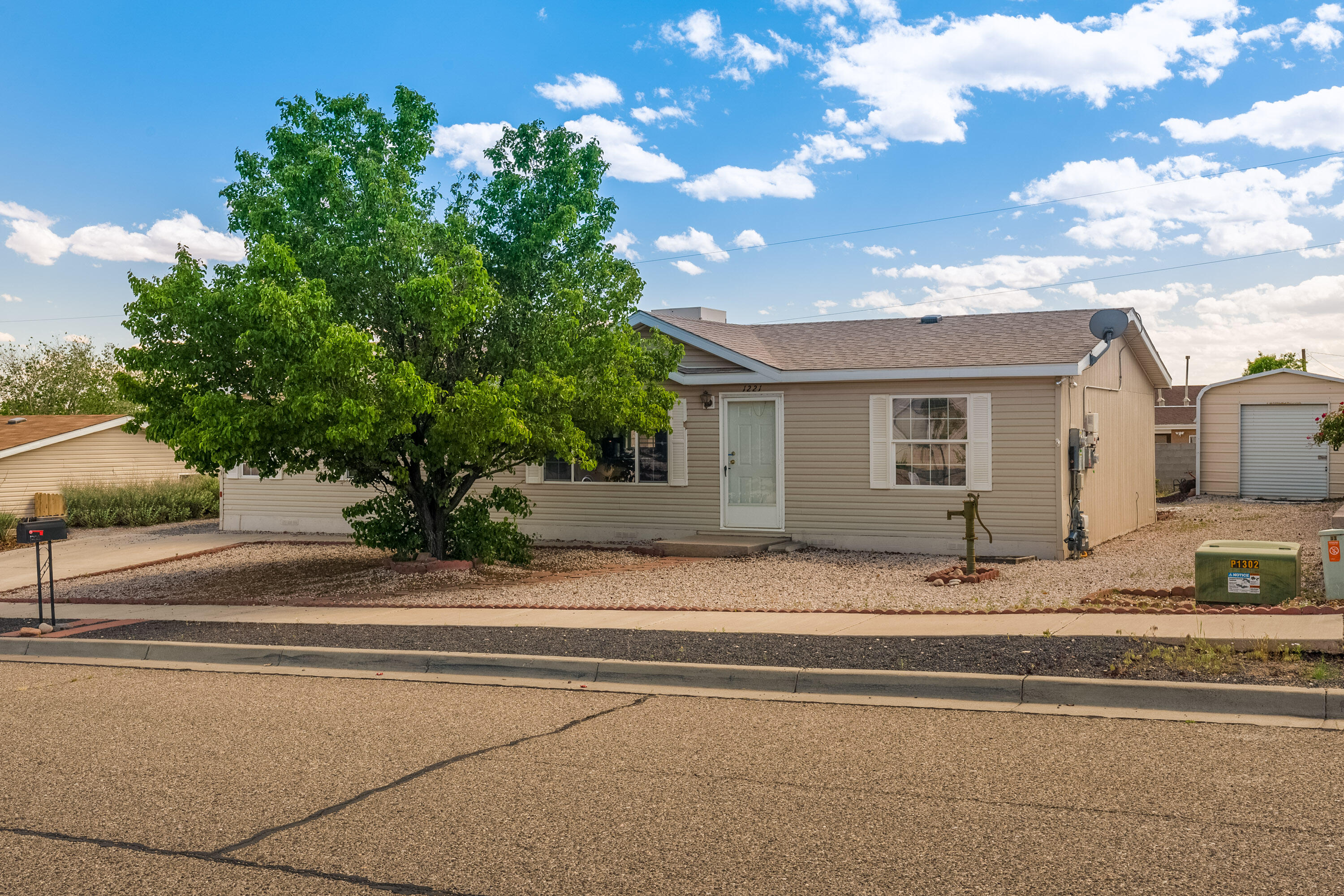 This move in ready, well cared for home has high ceilings, oversized closets, and tons of natural light. The primary bathroom was recently remodeled. And the kitchen has fresh paint. The appliances are also less than a year old with the exception of the washer and dryer that are less than 6 months old!! The solar will be paid off by the seller at closing and is less than 2 years old. The home is equipped with REFRIGERATED AIR perfect for the hot New Mexico summer. The back porch has a fire pit and the storage shed has electricity and a cooling unit. The seller has used it previously as a work shop, gym, and gaming room. Did I mention the 2 space carport?! In the heart of town, close to shopping, restaurants, and freeway access this home won't last long!