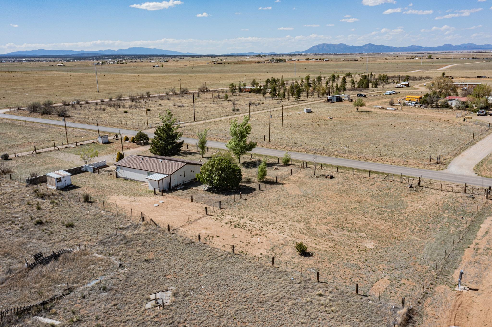 Welcome to this Move-in Ready, Single-Level, Quiet, Country Retreat in Moriarty, NM! Nestled on a Large, 1.25-Acre Lot, 2 Carl Lane features a Recent Septic System + Private Well Drilled in 2023! Brand-New Stainless Steel Refrigerator + Gas Range! Open Kitchen w/ Bar-seating Area, Breakfast Nook, Sliding-Glass Door to Huge Backyard. New Carpet. Brand-New Washer & Dryer Included! Make an appointment to see this Home today!