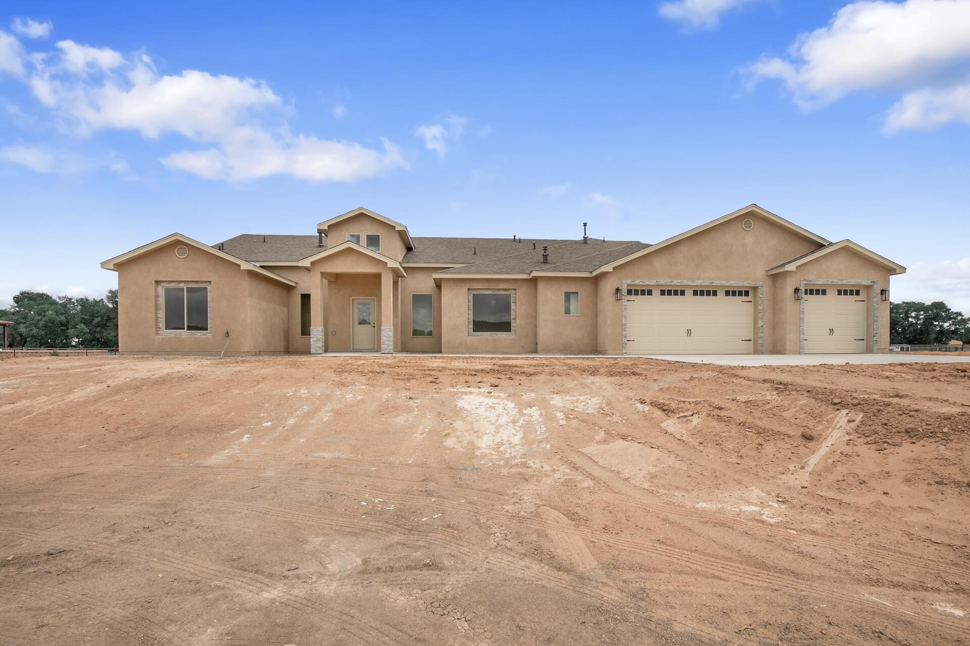What a wonderful opportunity to purchase this newly completed home situated on 2 acres in a desirable area of Valencia County! With custom features throughout, this home will surely exceed your expectations. Custom cabinetry, granite countertops, tile backsplash, flooring and shower surrounds. The floor plan is open, spacious and perfect for entertaining.