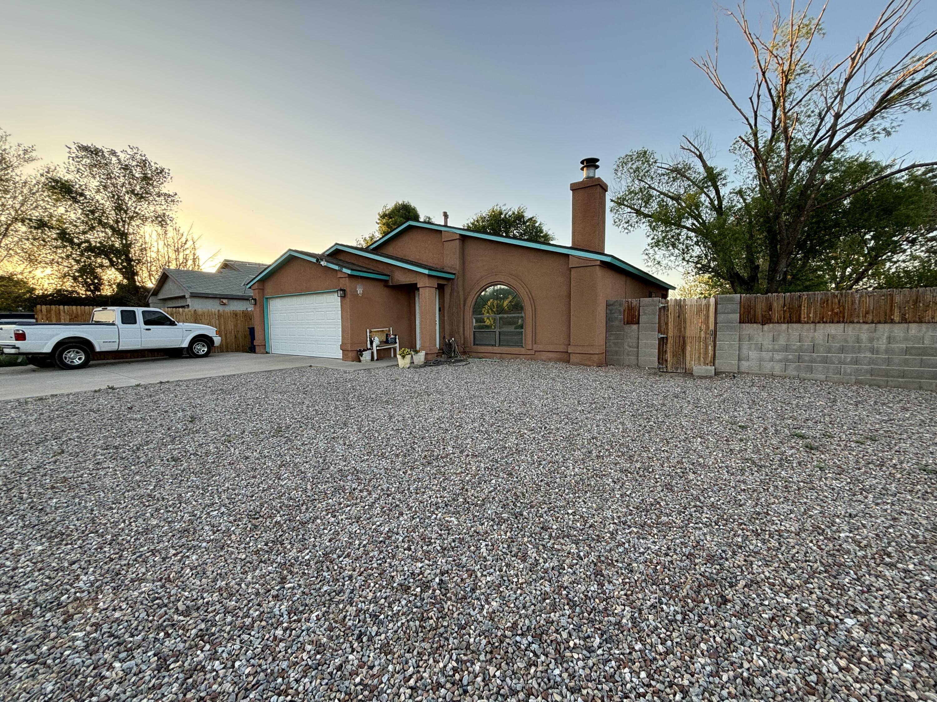 FANTABULOUS 3 bedroom, 2 bath house in the heart of Los Lunas.  Spacious living room with cathedral ceiling, plant ledge and fireplace.  Step-saver kitchen with all appliances.  Dining area has access to covered porch.  Private backyard with large shade tree.  Attached 2-car garage.