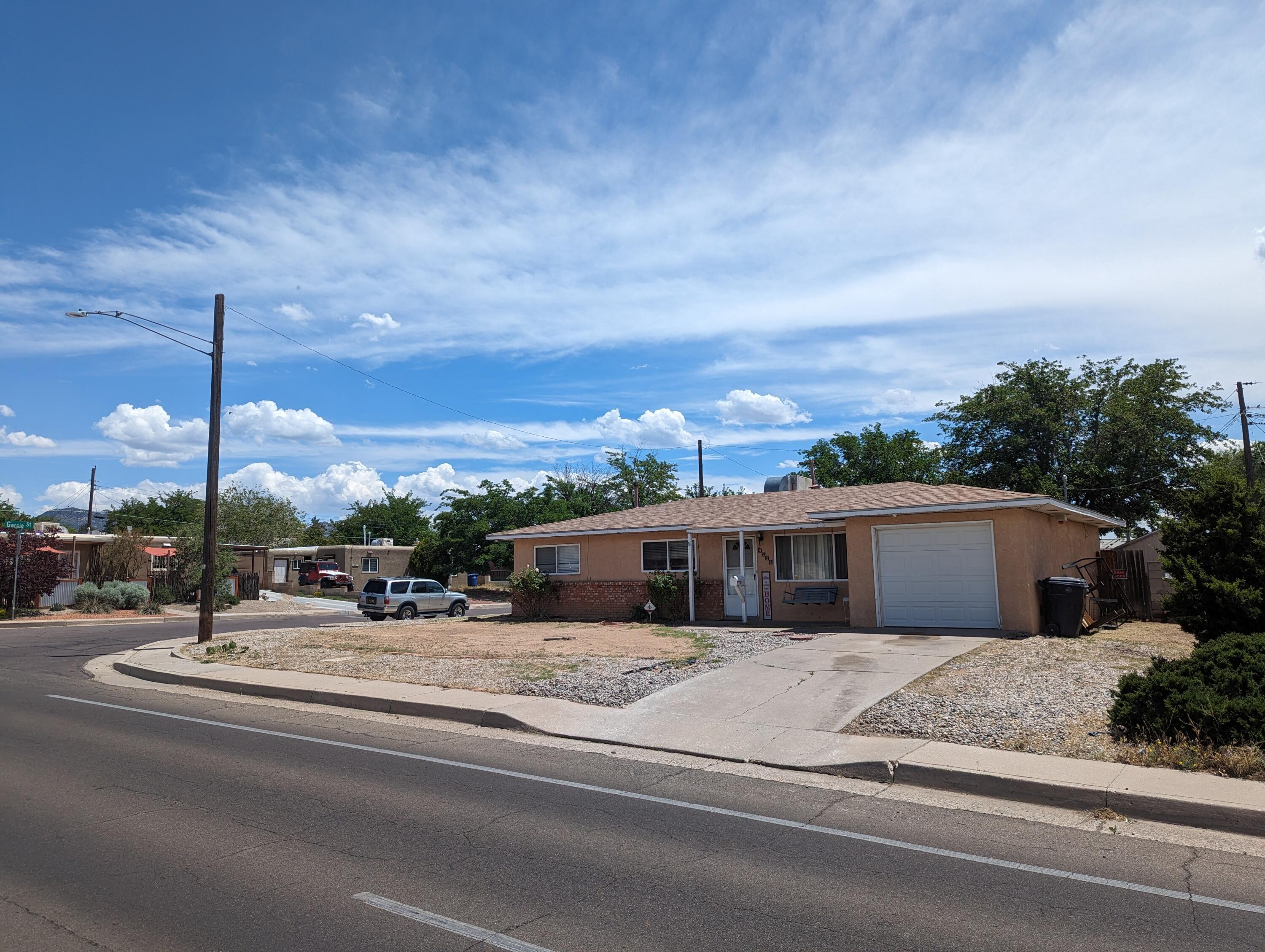 One story charming and well cared for three-bedroom home in fabulous NE location. This open, light, welcoming flowing floor plan accompany with laminate and tile flooring.  Extra deep one car garage(can fit two small cars). Selling As-Is