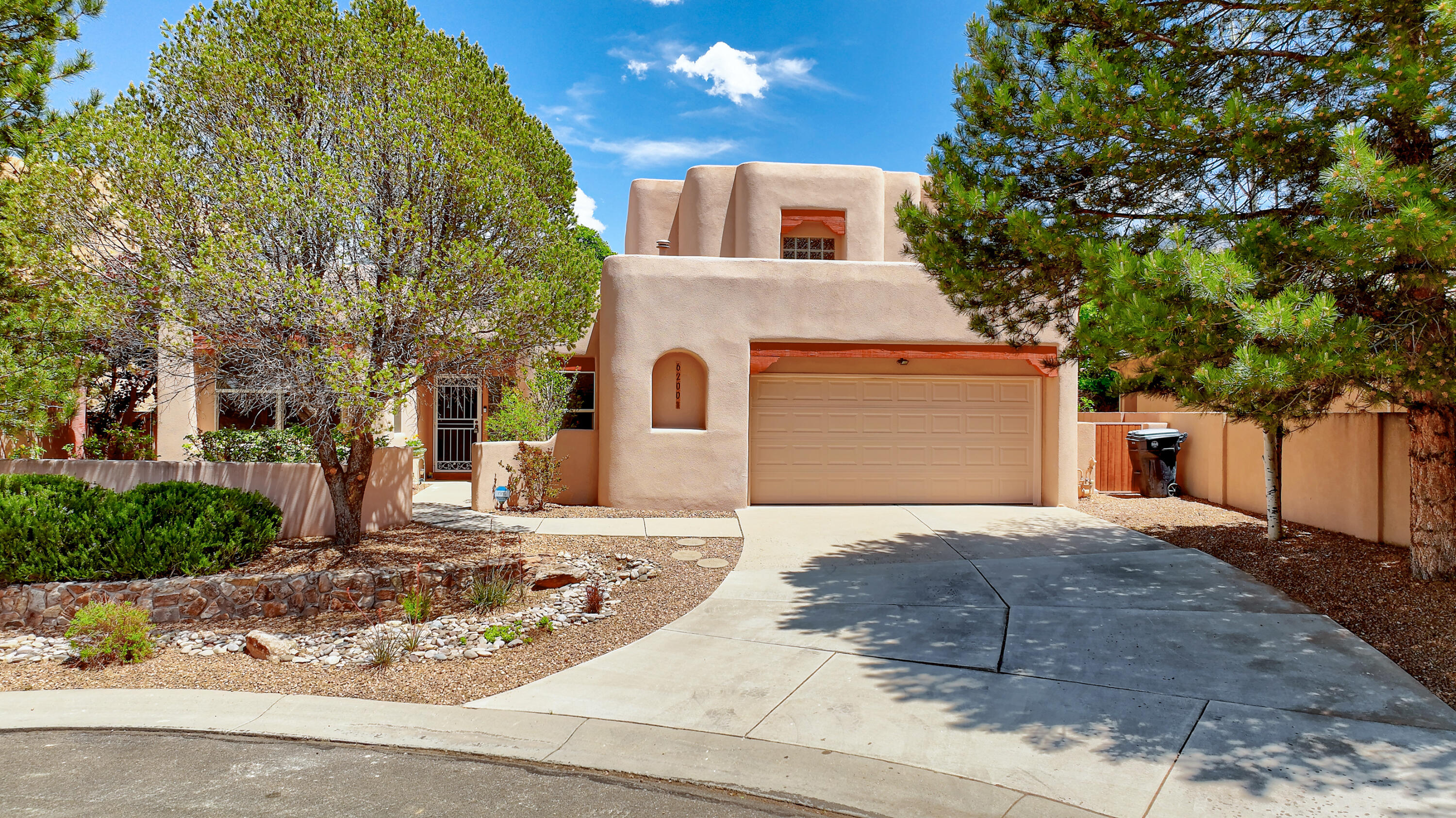Welcome to this captivating, Santa Fe style custom home in High Desert on a private culdesac lot w/ views. Designer color scheme, beautiful finishes & a park like back yard.Updated chef's kitchen with breakfast bar, nook & SS appliances. Private Primary suite features hardwood floors, corner Kiva gaslog fireplace and covered deck with swing & some of the best mountain views in High Desert. Interior features no carpet, custom ceramic tile, porcelain travertine & tumbled marble finishes, dramatic living /dining room raised wood beam T & G ceiling w/ east wall of windows for light & more views. Potential fourth bedroom/Den/Media room, currently being used as an office.Enjoy Tranquil outdoor living from the front courtyard filled w/ roses, the private backyard w/ covered & open patio areas