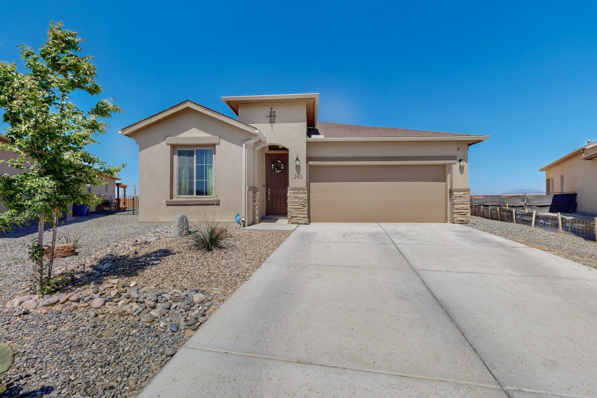 Welcome Home to this immaculate turnkey home in Los Lunas! Step into this 4-bedroom 2 bath, 2 car garage home boasts lots of light. The inviting chef's kitchen offers granite countertops, upgraded stainless steel appliances, cook top ,castle style cabinets, large walk-in pantry and large island that leads into the dining area and great room. The primary suite has beautiful custom shower, large walk-in closet, double sinks, trey ceilings and split floor plan for privacy. The home offers 8 ft doors throughout upgraded tile and high ceilings, the backyard has a covered patio, larger lot ,VIEWS all the way around. Located with easy access freeway and in one of NM fastest growing employment hubs.