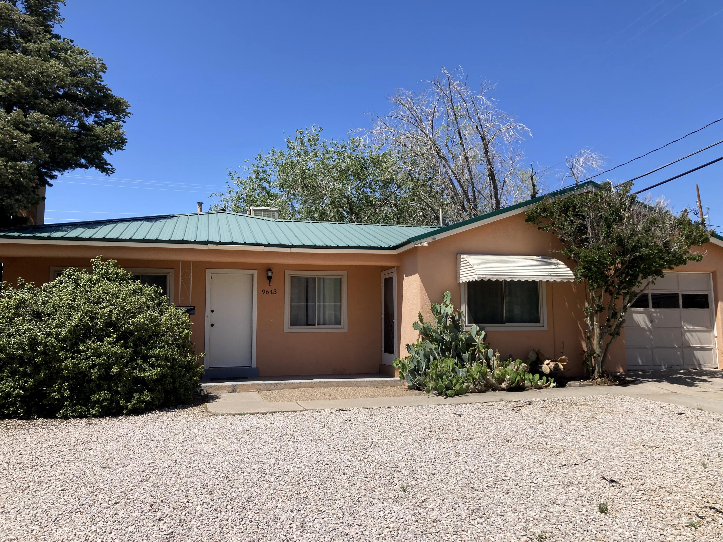 This home in Albuquerque's Northeast Heights area offers 4 beds, 2 baths, a converted garage space, and a pitched metal roof. Outside, a fenced backyard with a storage shed awaits. Conveniently located near parks and shopping. Schedule your showing today!