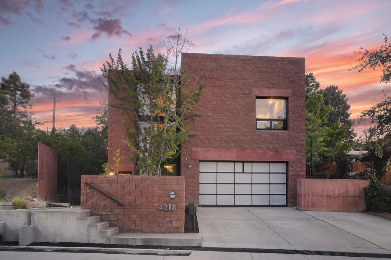 Architectural marvel located just around the corner from Altura Park offers highly desirable urban location in addition to private peace & quiet. A complimentary mix of the strong, clean lines of glass, steel & cement combined with warm natural light & wood flooring. Soaring ceilings on both levels, but especially accentuated from the expansive living area that visually moves into the well-treed backyard landscape. This contemporary plan lives mostly on the second story at tree level with an open concept kitchen, living, dining & office, plus a shaded patio & owner suite with a mountain view. Almost every room has custom minimalist cabinetry & shelving, and ample wall space for art of every size & style. The ground floor has 3 additional bedrooms, 2 baths + a glass walled sitting area....